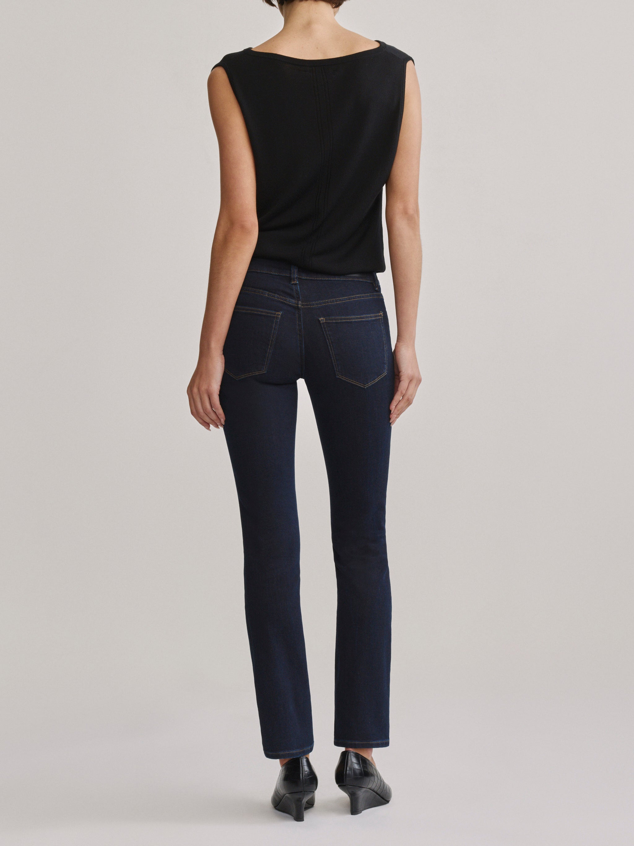 DL1961 Jessica Skinny low-rise jeans in dark indigo 'Harvest Moon', back full-length view.