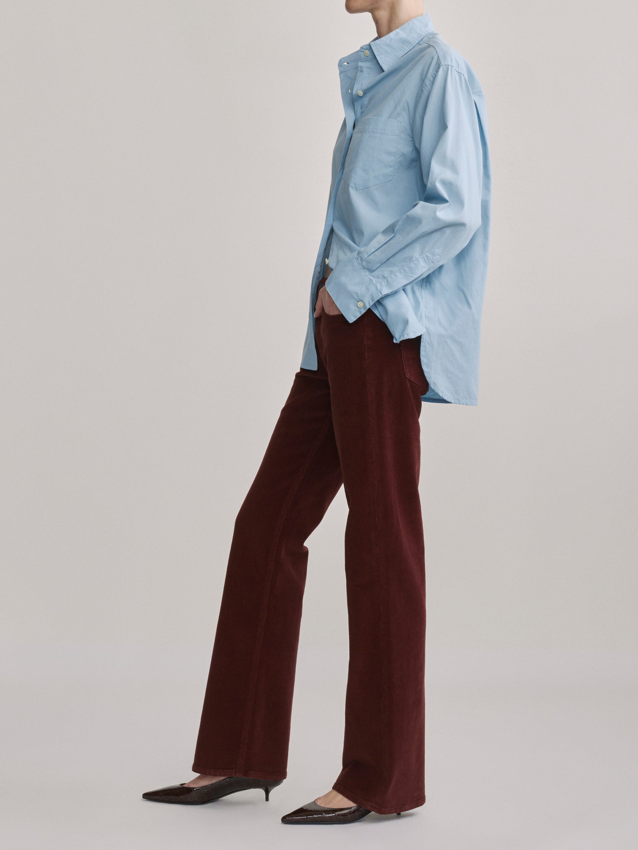 DL1961 Bella slim bootcut mid-rise corduroy jeans in wine 'Syrah Cord', side profile view.