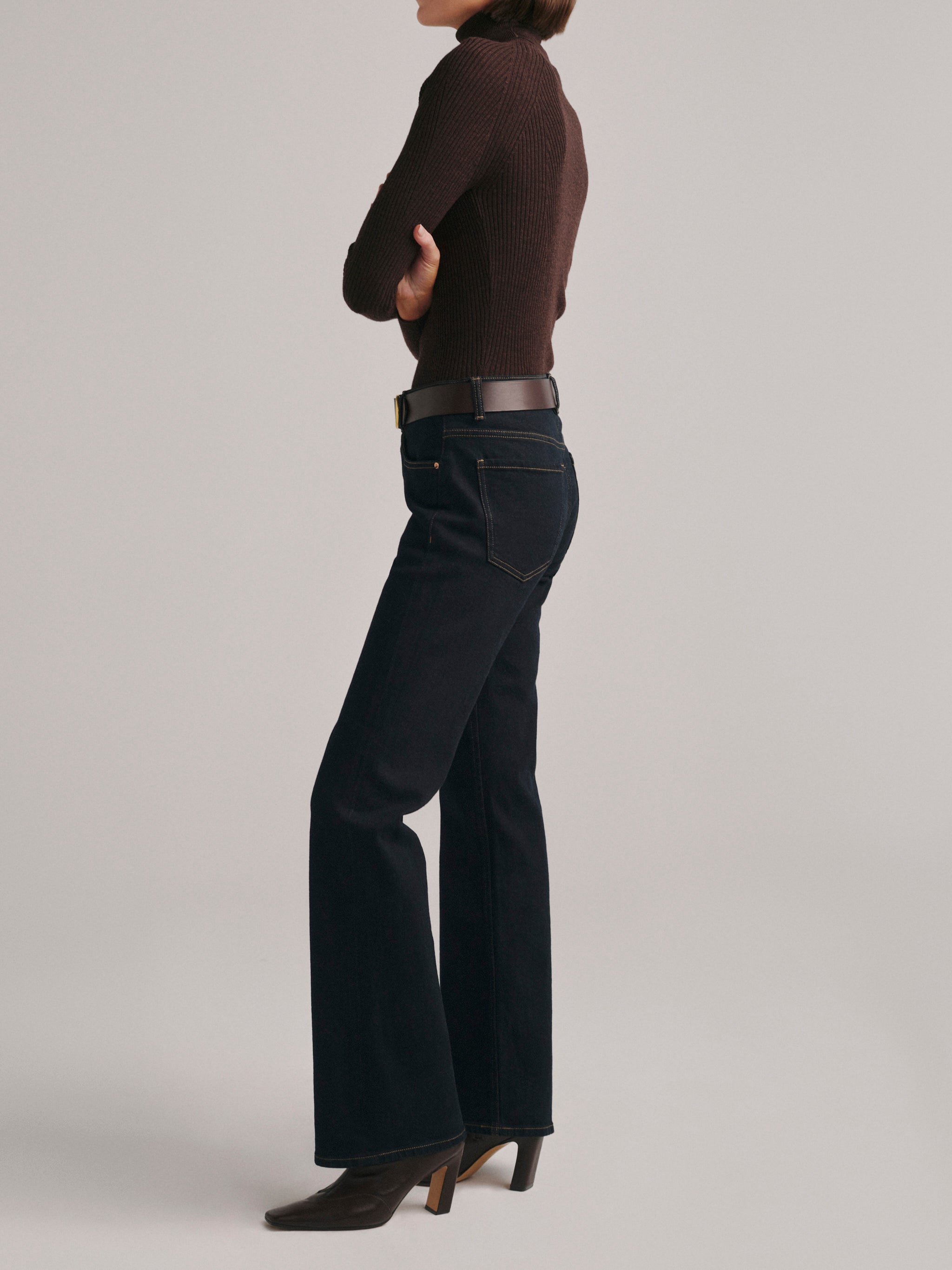 DL1961 Bella Slim Bootcut mid-rise jeans in dark indigo rinse 'Harvest Moon', back three-quarter view.