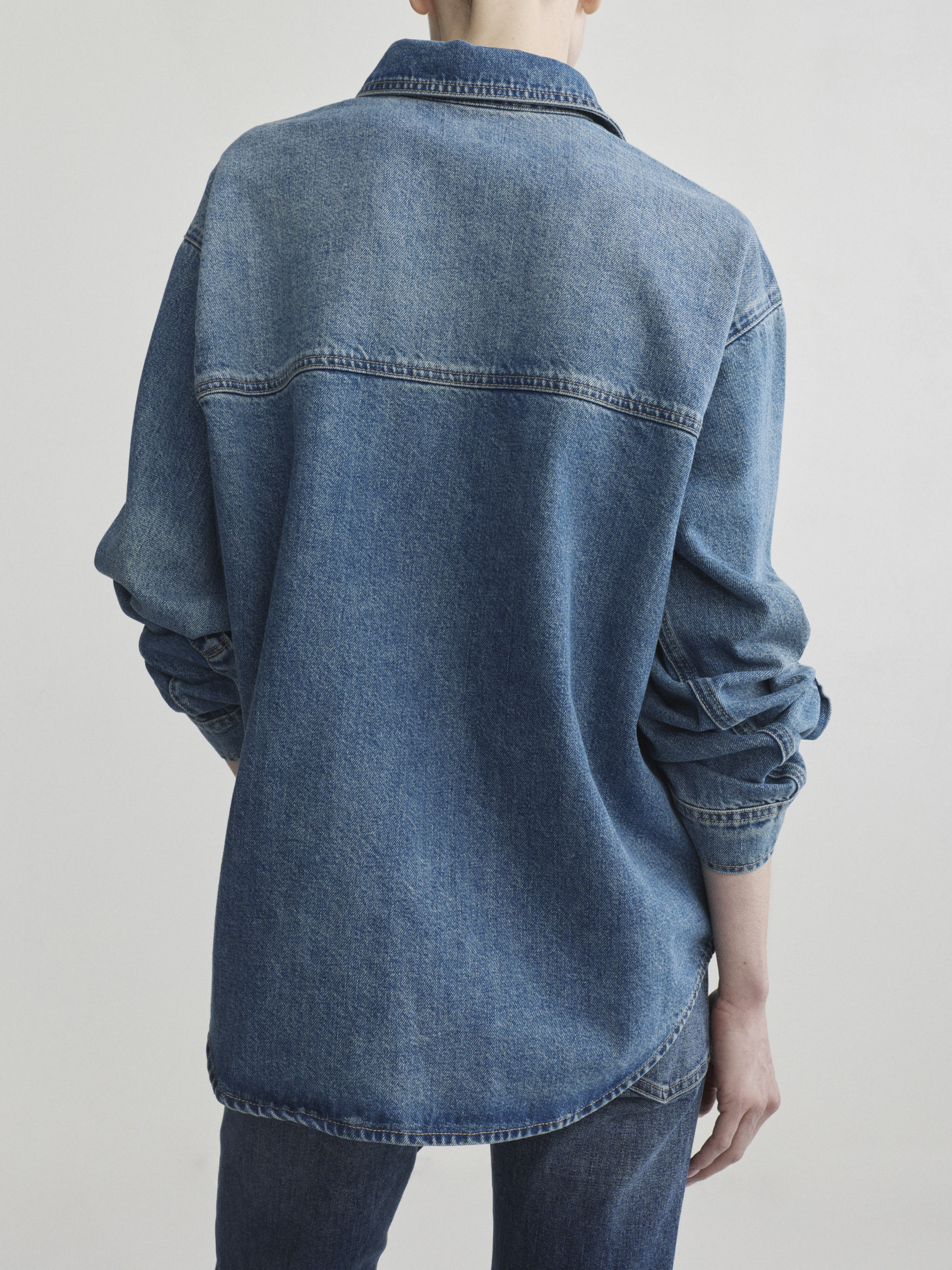 Bella jeans in Quiet with Endless Sea Addison Overshirt, model back view, upper-body crop.