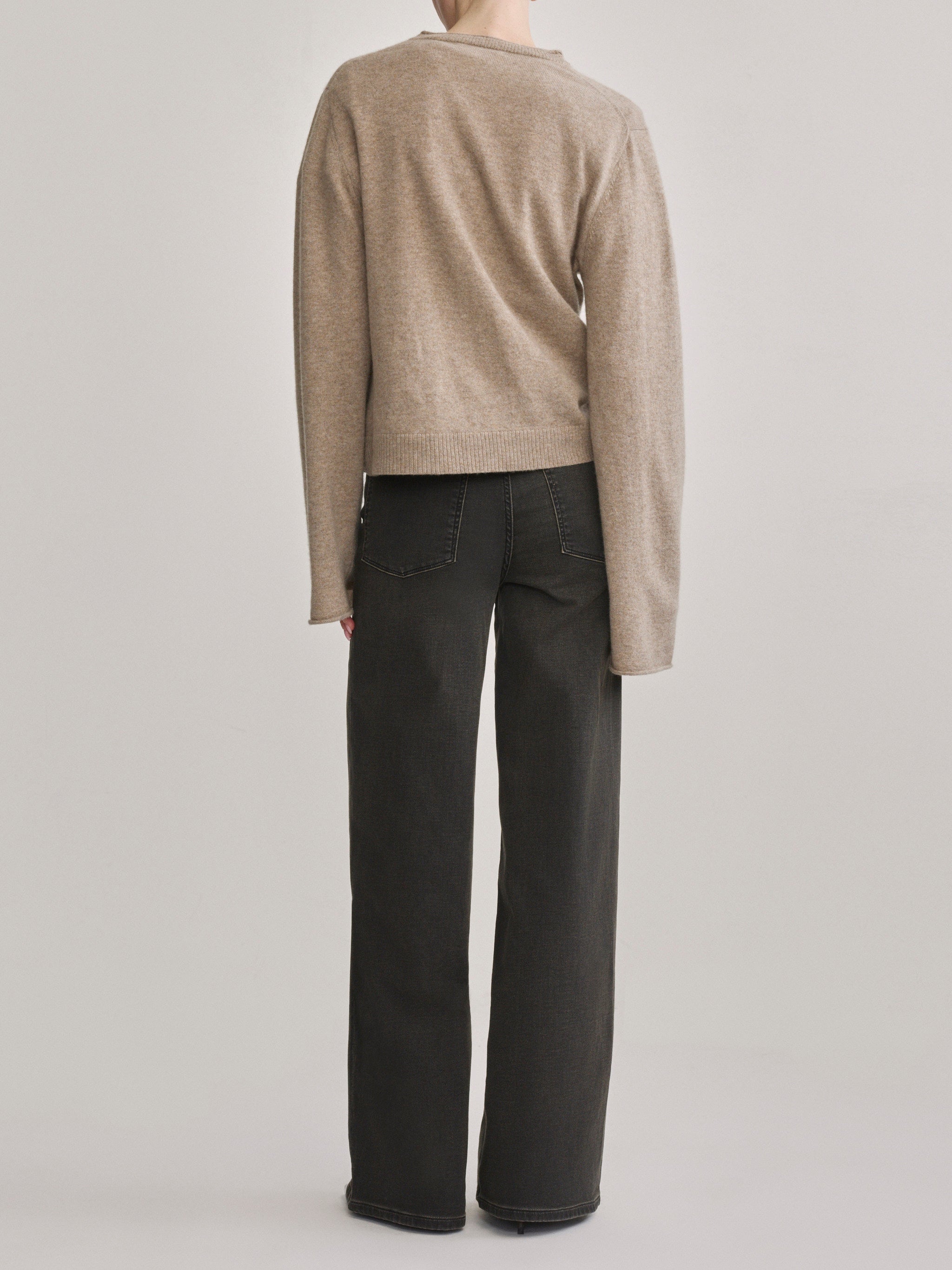 DL1961 Hepburn wide-leg high-rise jeans in washed black 'Rock', back view.