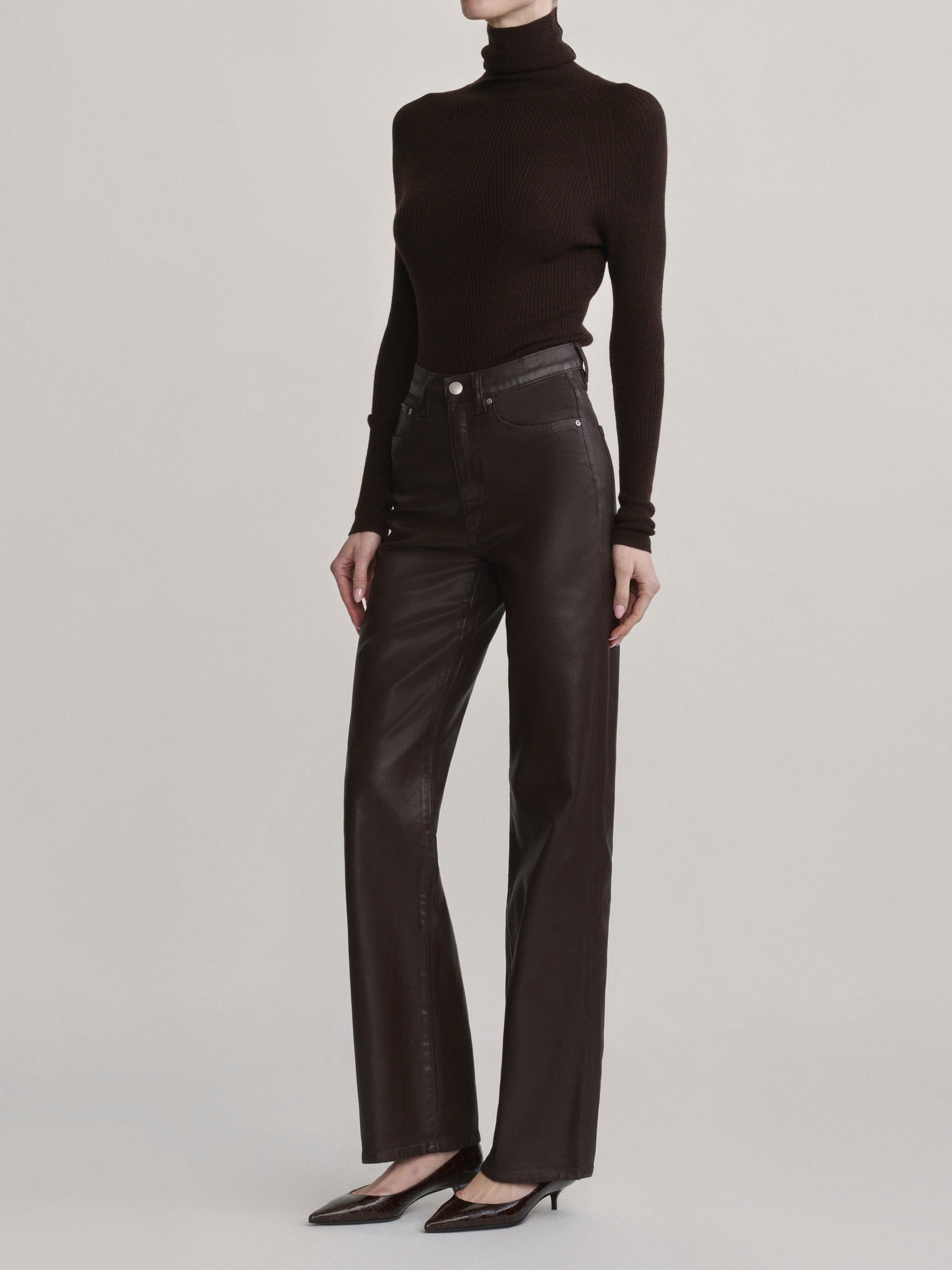 DL1961 Karmine wide-leg high-rise jeans in coated dark berry-brown 'Bramble Coated', side profile view.