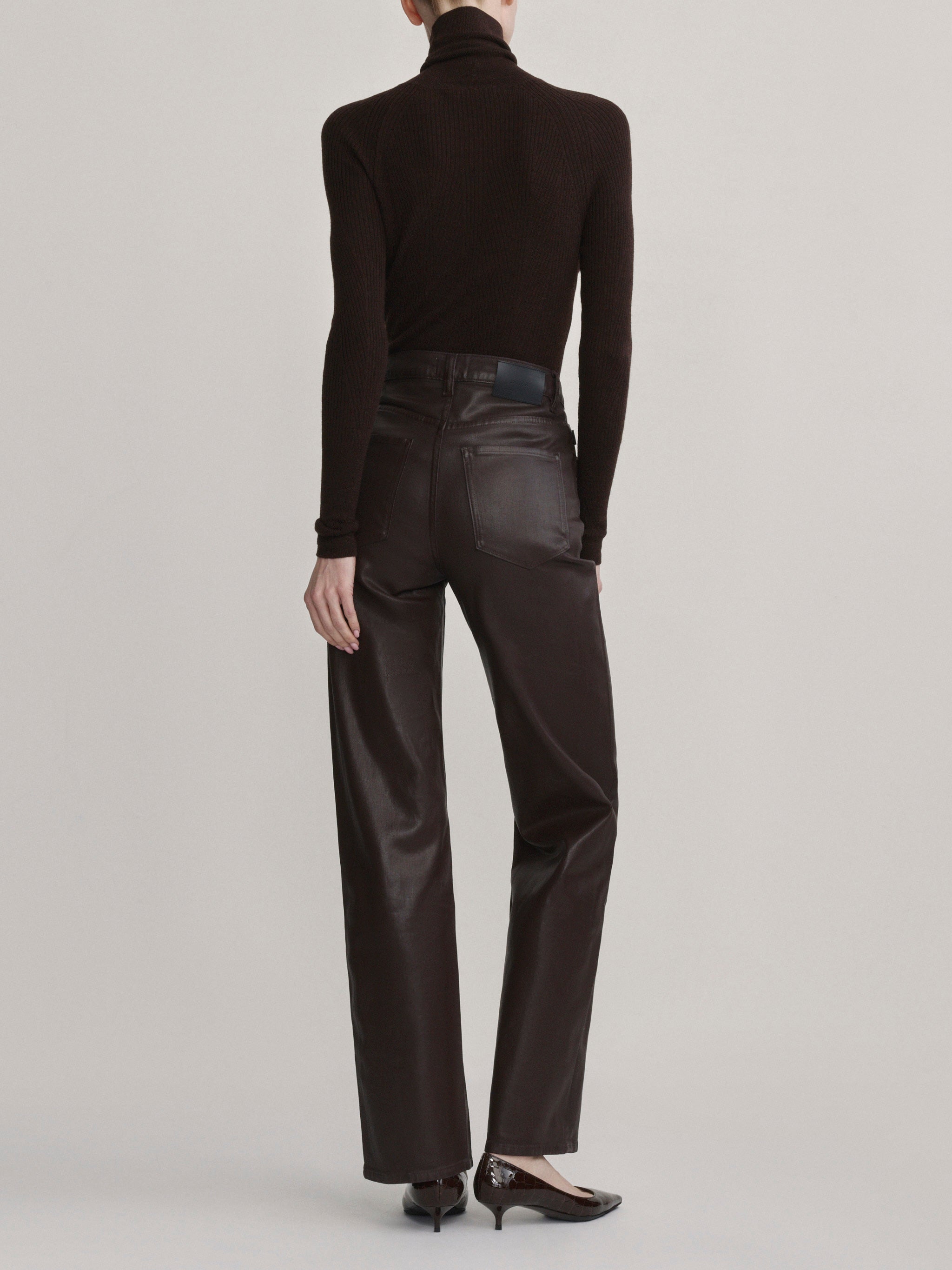 DL1961 Karmine wide-leg high-rise jeans in coated dark berry-brown 'Bramble Coated', back full-length view.