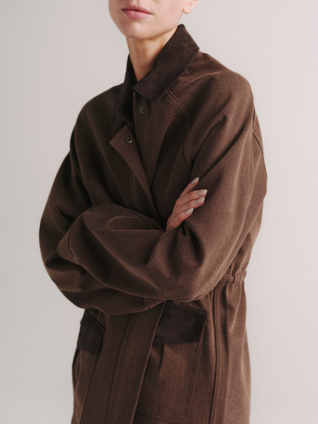 Cate Slim jeans in Mid Dark with Brownstone Field Jacket, model side view, arms crossed, upper crop.