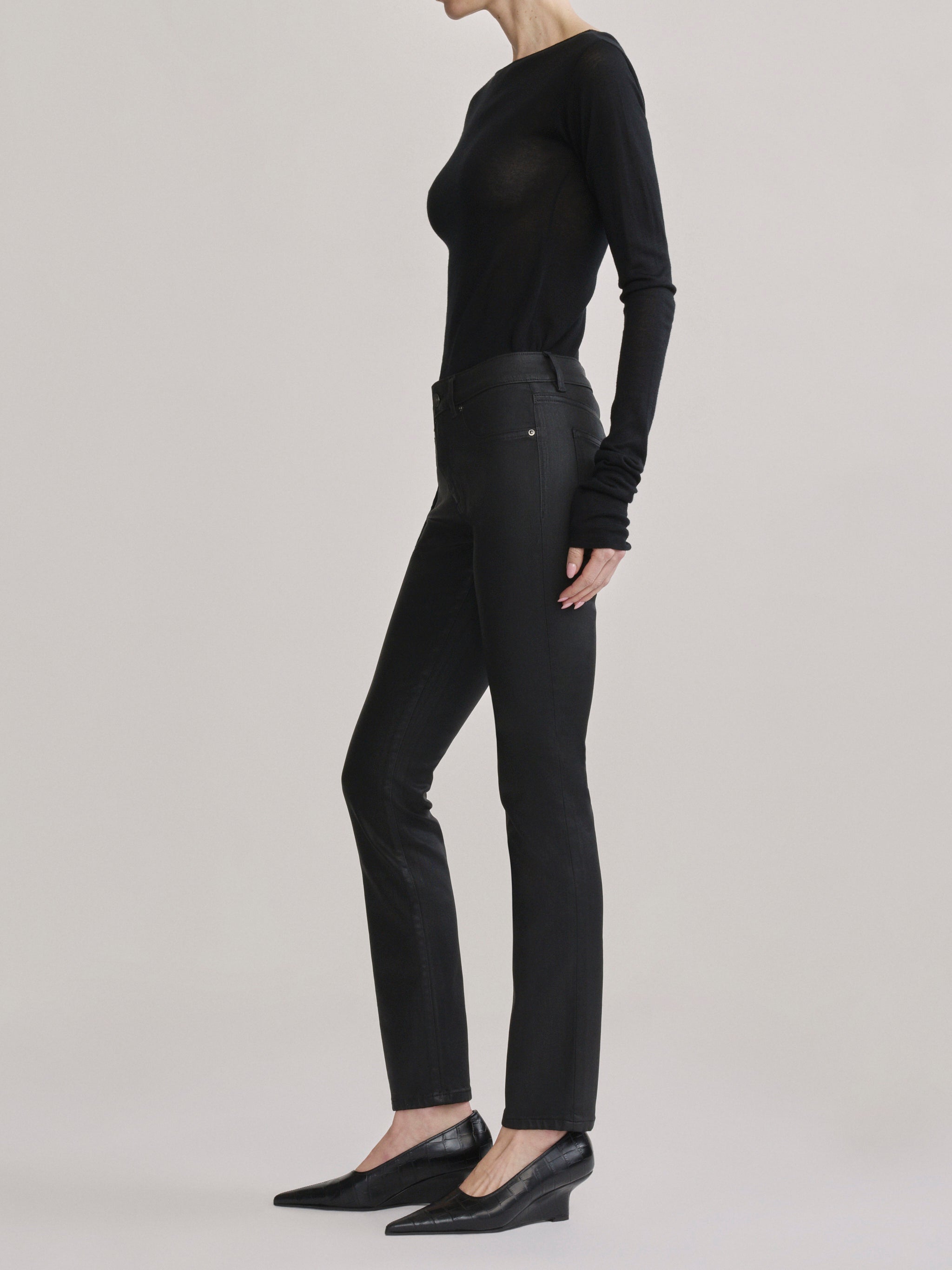 DL1961 Jessica Skinny Low-Rise coated jeans in Black Coated, glossy finish, side profile.