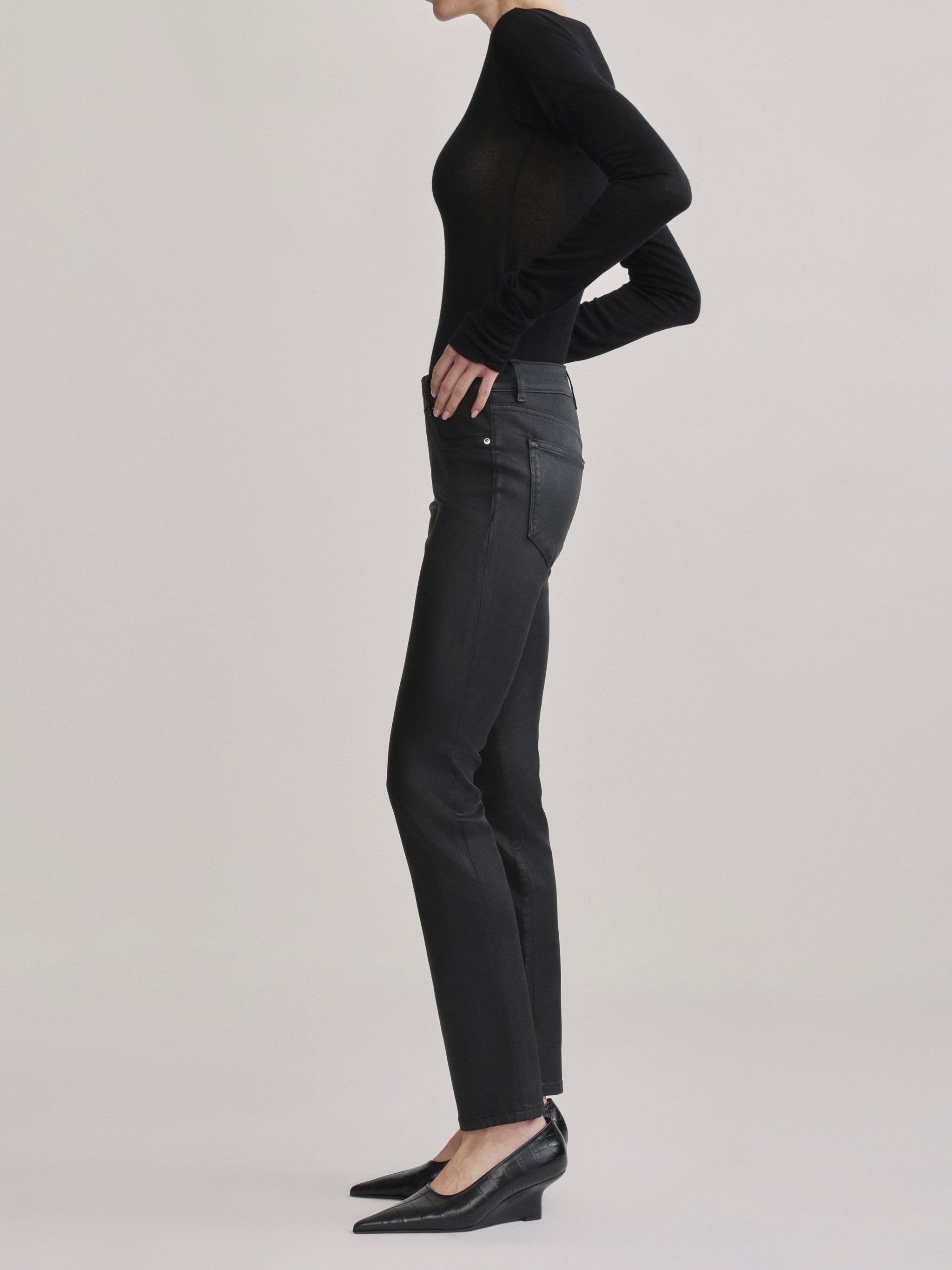DL1961 Jessica Skinny Low-Rise coated jeans in Black Coated, rear three-quarter view.