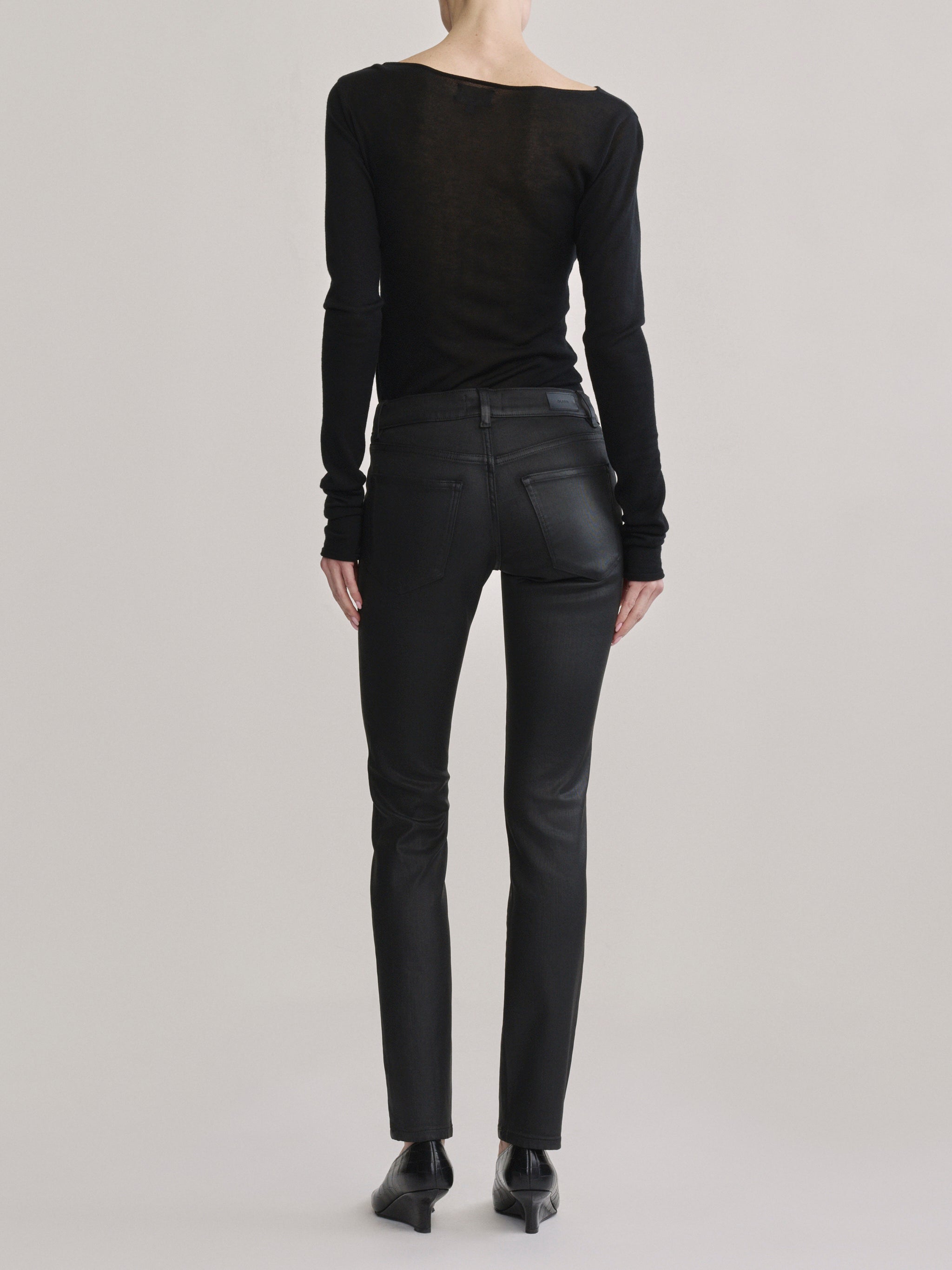 DL1961 Jessica Skinny Low-Rise coated jeans in Black Coated, glossy finish, back view.