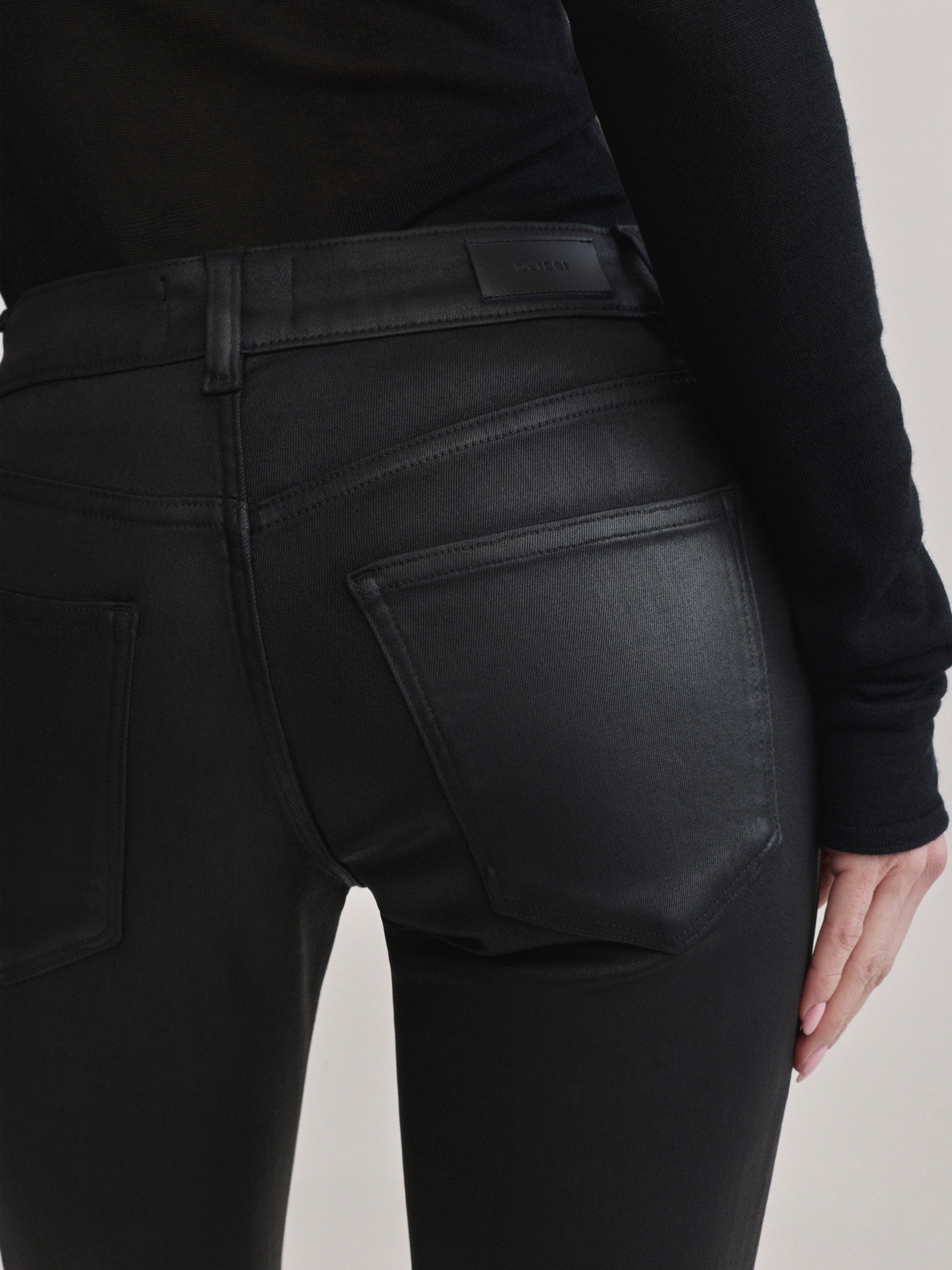 DL1961 Jessica Skinny Low-Rise coated jeans in Black Coated, close-up of glossy back pocket.