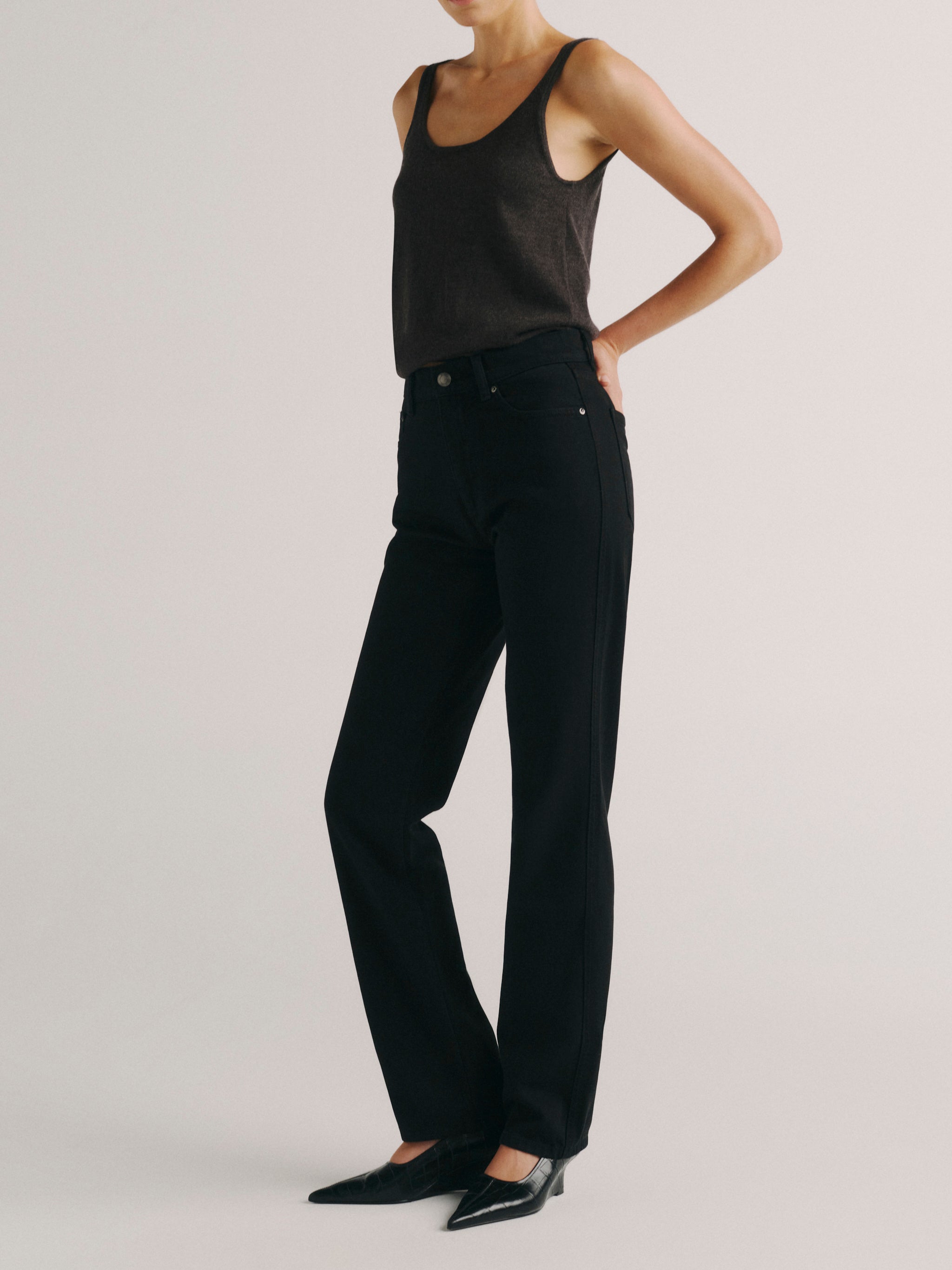 DL1961 women's Cate Classic Straight high rise jeans in black, angled front view showing the full-length straight leg.