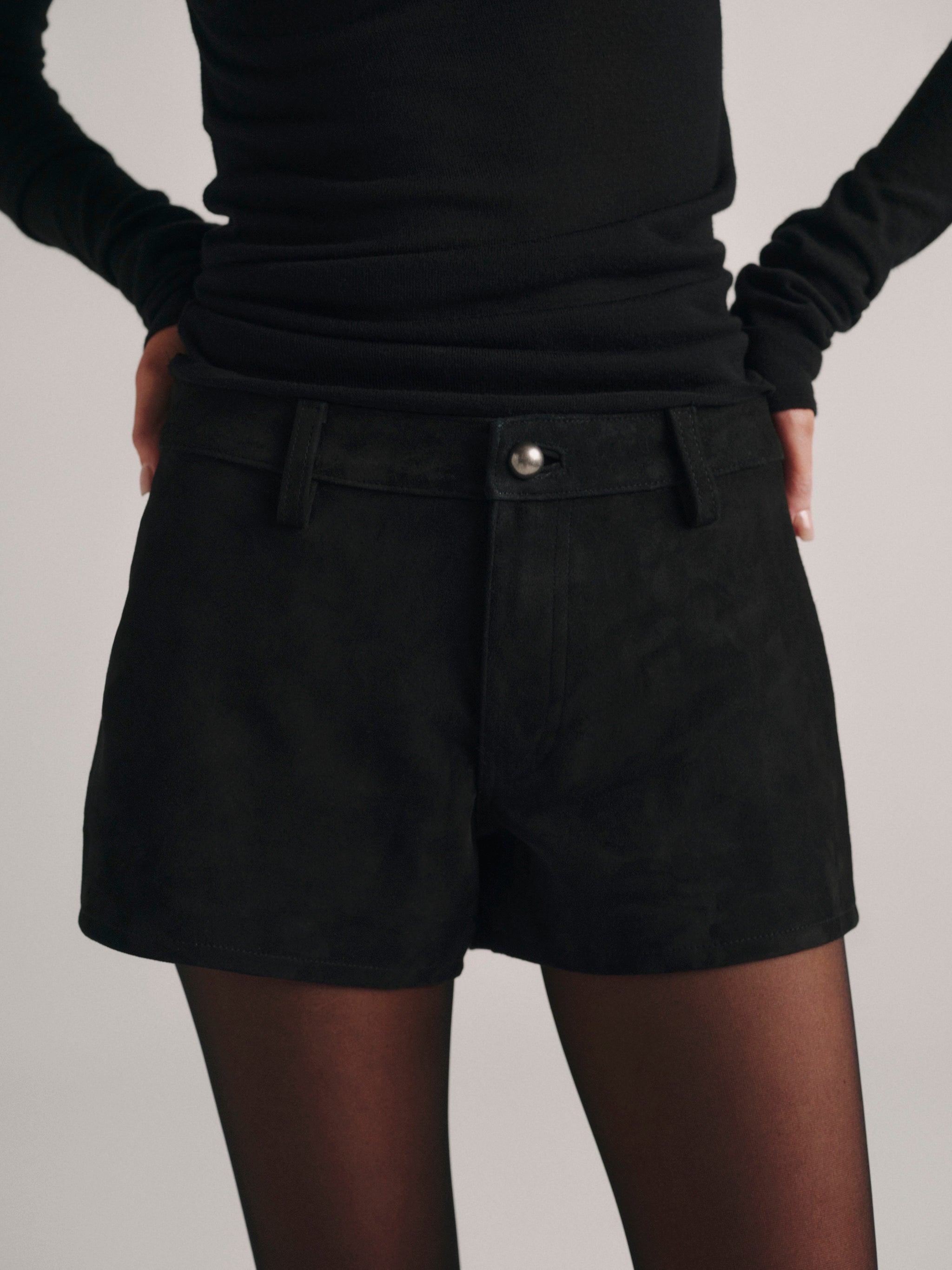 DL1961 Abby Relaxed Suede Shorts in black 'Black Suede', waist and button close-up.