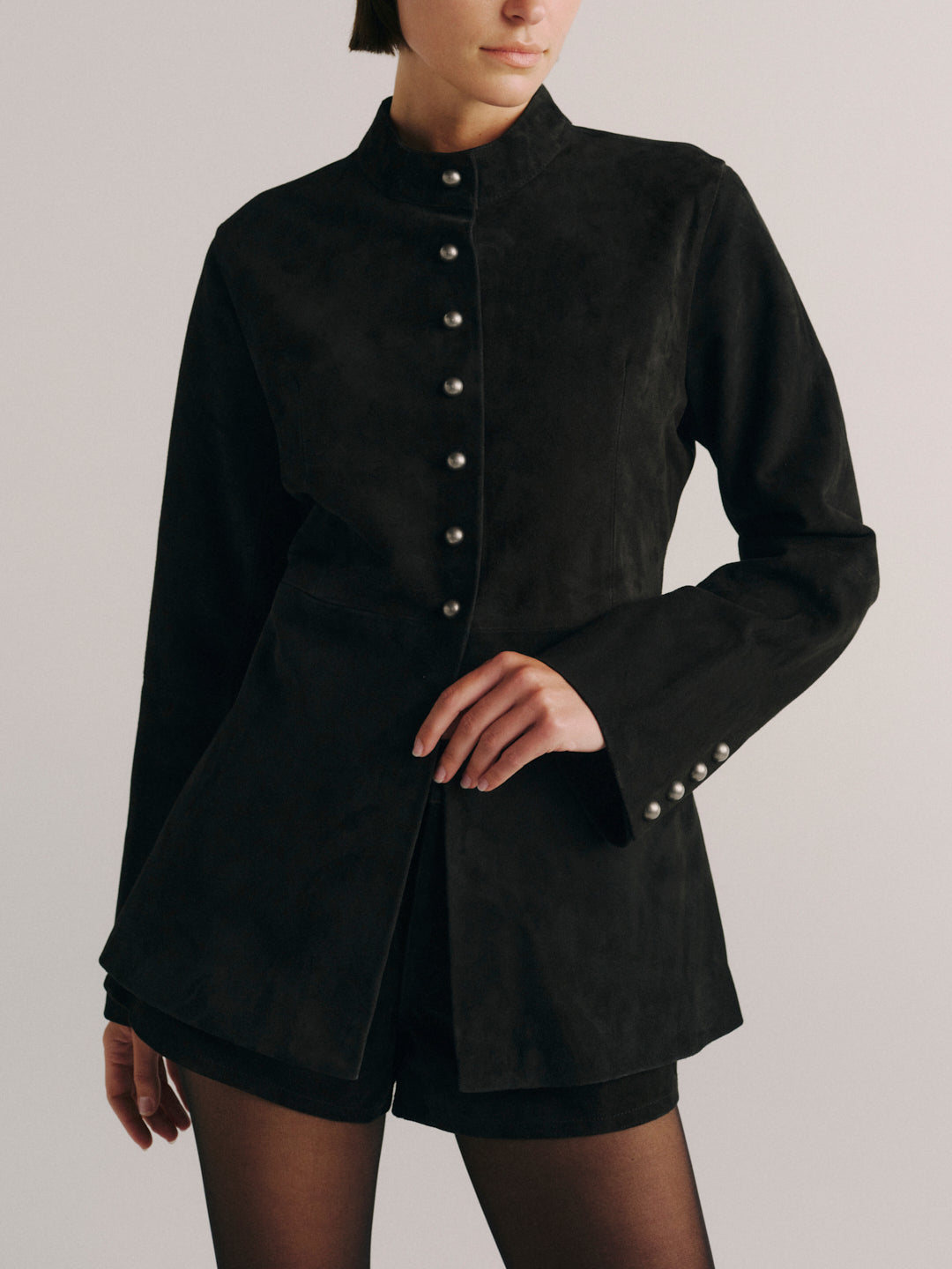 DL1961 Maria Suede Jacket in black suede, fitted snap-front with stand collar and flared cuffs, front detail.