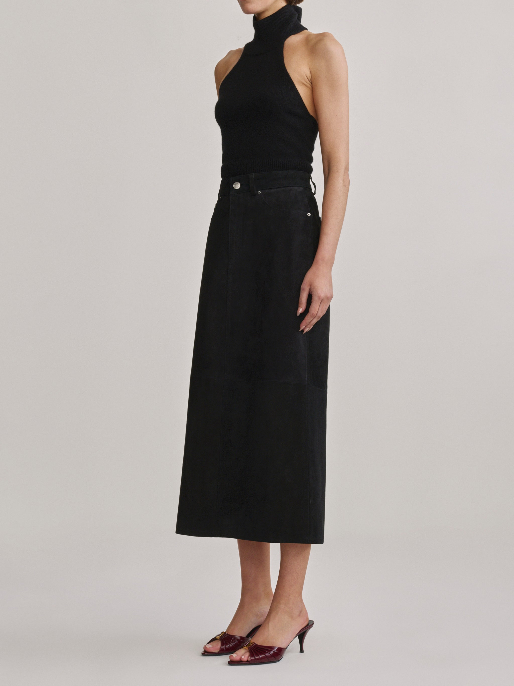 DL1961 Alma Suede Midi Skirt in Black Suede, A-line silhouette, three-quarter front view.