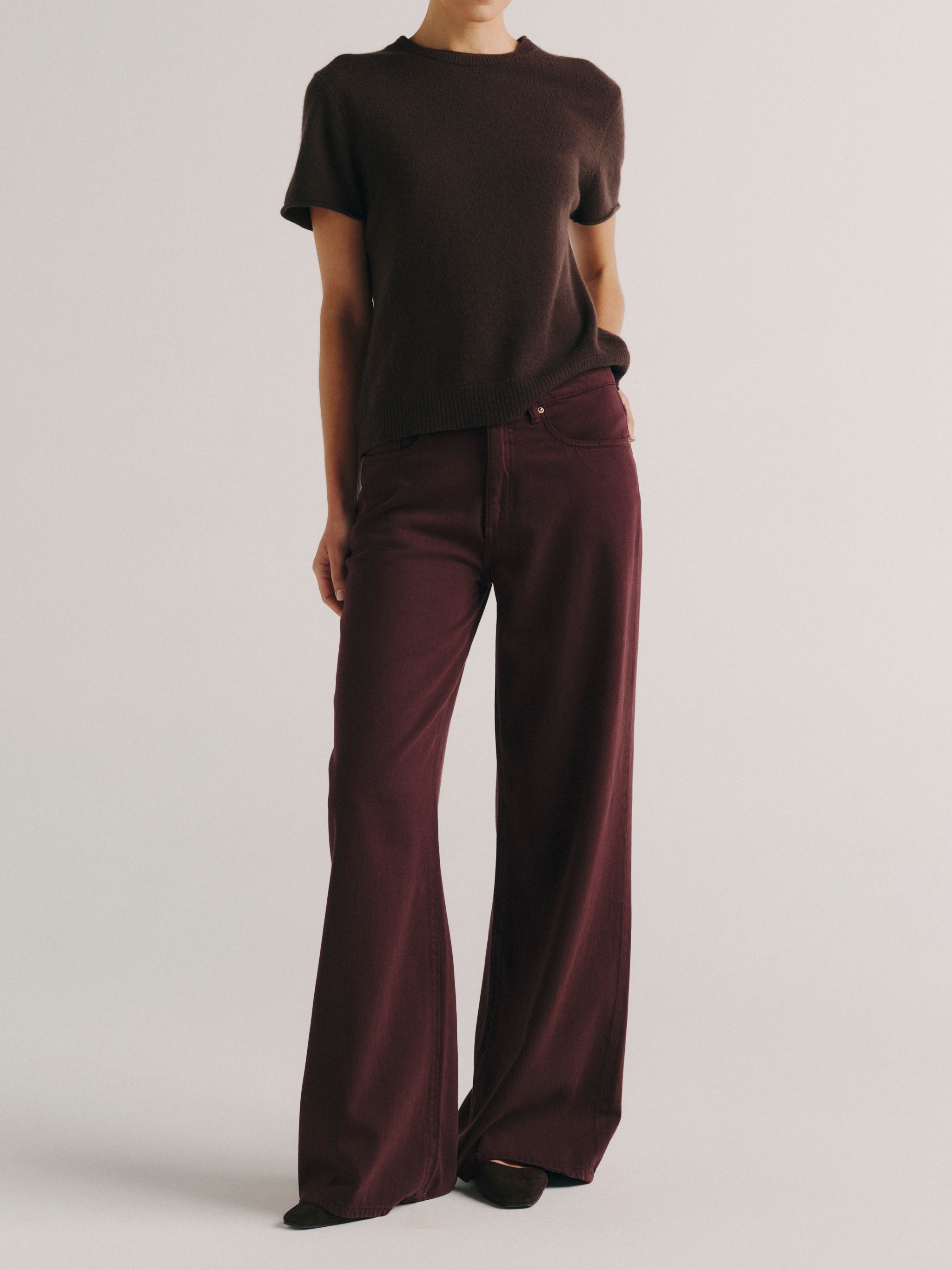 DL1961 women's Alex Baggy Wide Leg jeans in deep burgundy 'Bordeaux Aura', front full-length view on model with brown tee.