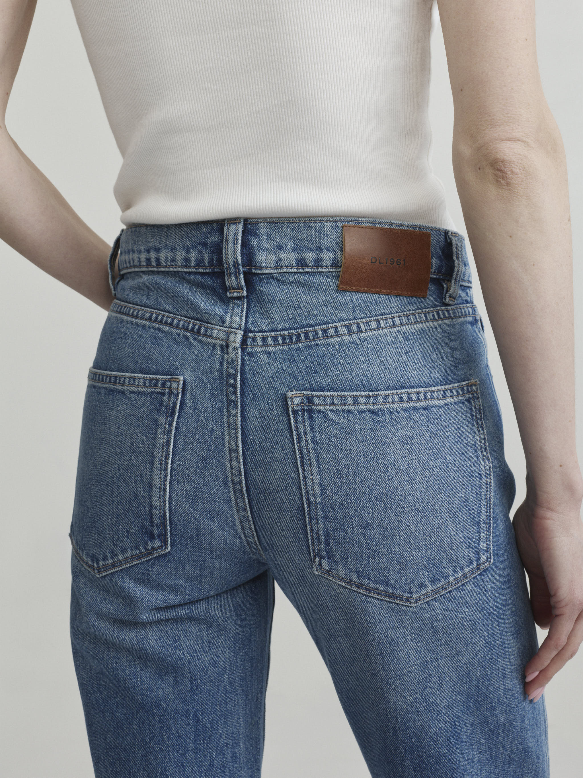 Dakota Slim Straight jeans in Endless Sea, close-up of back pockets and hip detail.