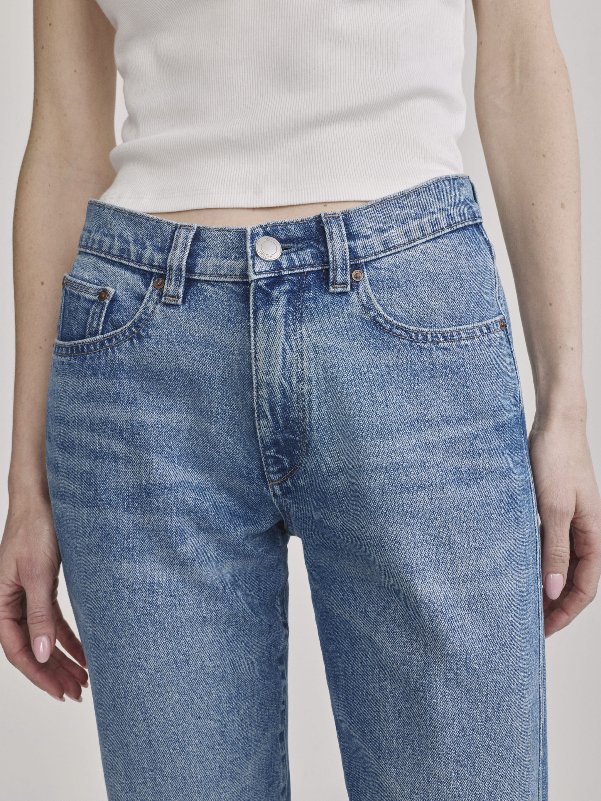 Waistband and button-fly detail of DL1961 Dakota Slim Straight jeans in 'Endless Sea' medium wash.
