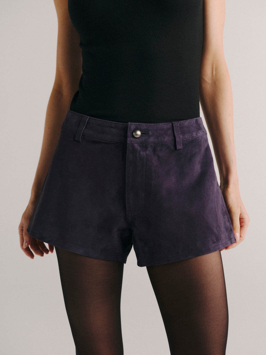 DL1961 Abby Relaxed Suede Shorts in purple 'Plum Suede', waist and button close-up.
