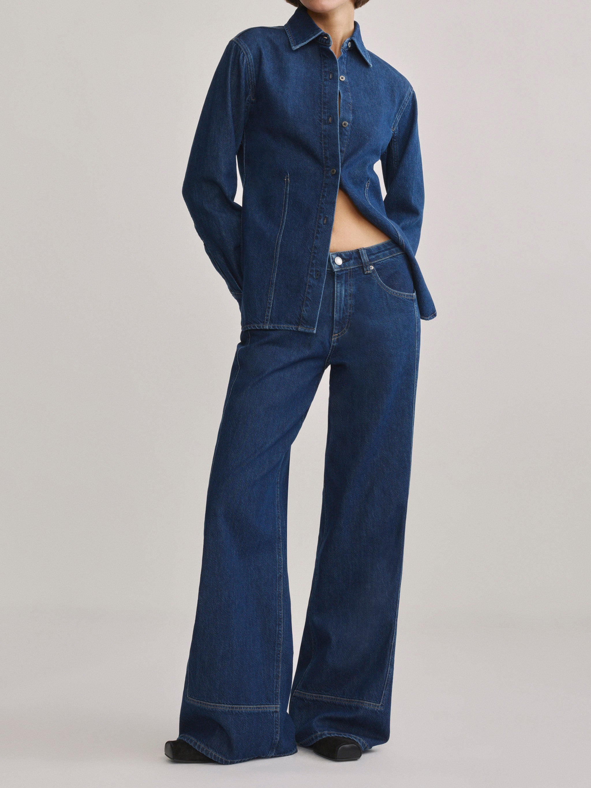 DL1961 Alex baggy wide-leg low-rise jeans in blue indigo 'Inkwell Aura', front view styled with matching denim shirt.