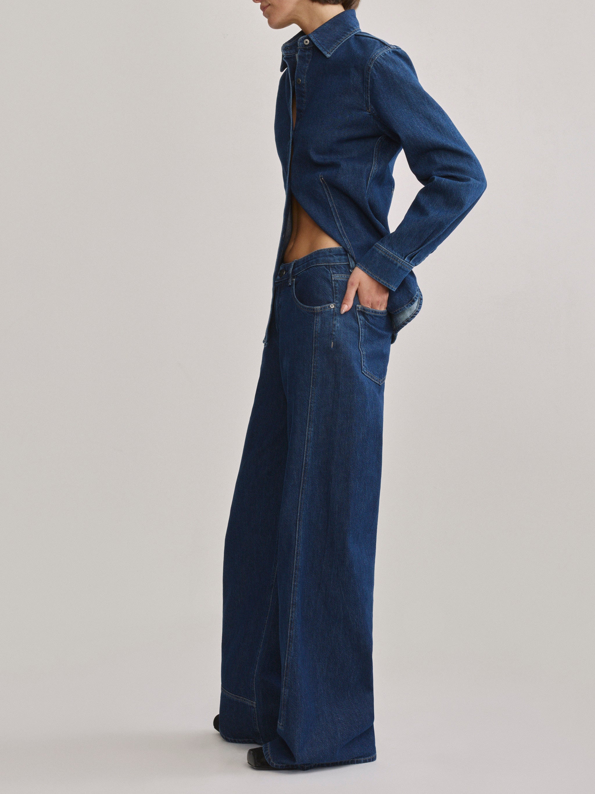DL1961 Alex baggy wide-leg low-rise jeans in blue indigo 'Inkwell Aura', side profile showing low rise and wide leg.