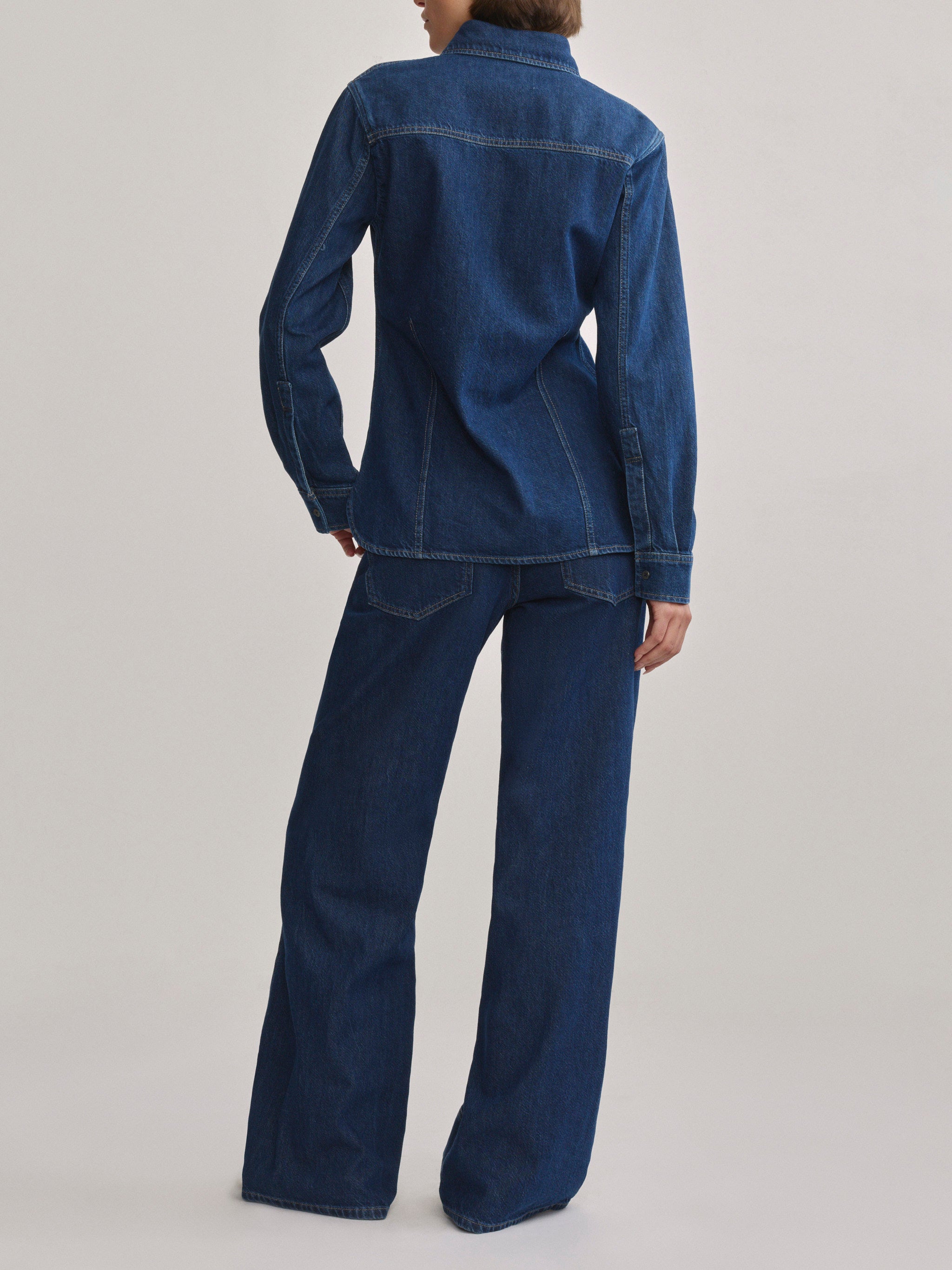 DL1961 Alex baggy wide-leg low-rise jeans in blue indigo 'Inkwell Aura', back view of the wide-leg silhouette.