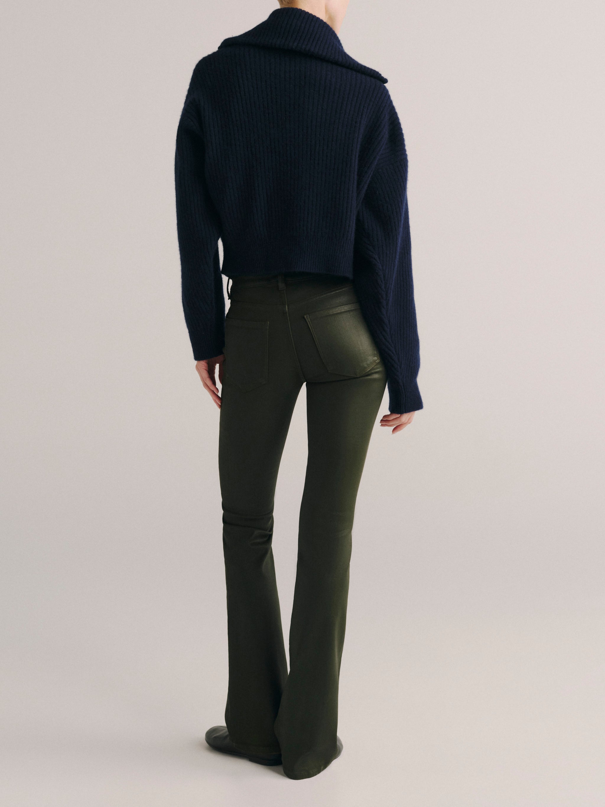 DL1961 women's Milano Slim Boot Low Rise Instasculpt jeans in coated dark olive 'Dark Pine Coated', back view showing the rear pockets.