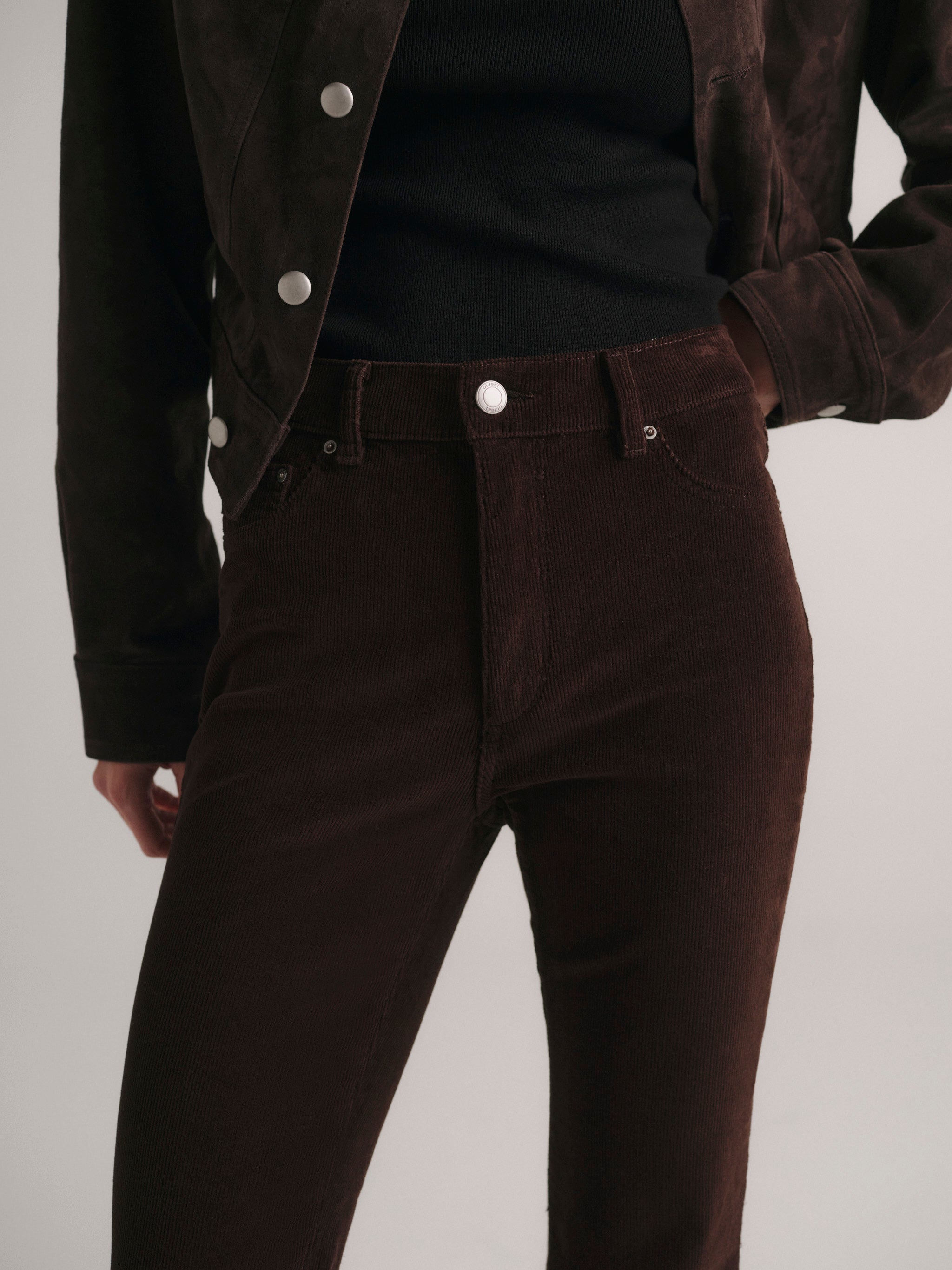 DL1961 Bridget Bootcut petite jeans in dark brown corduroy 'Meteorite', front waist close-up.