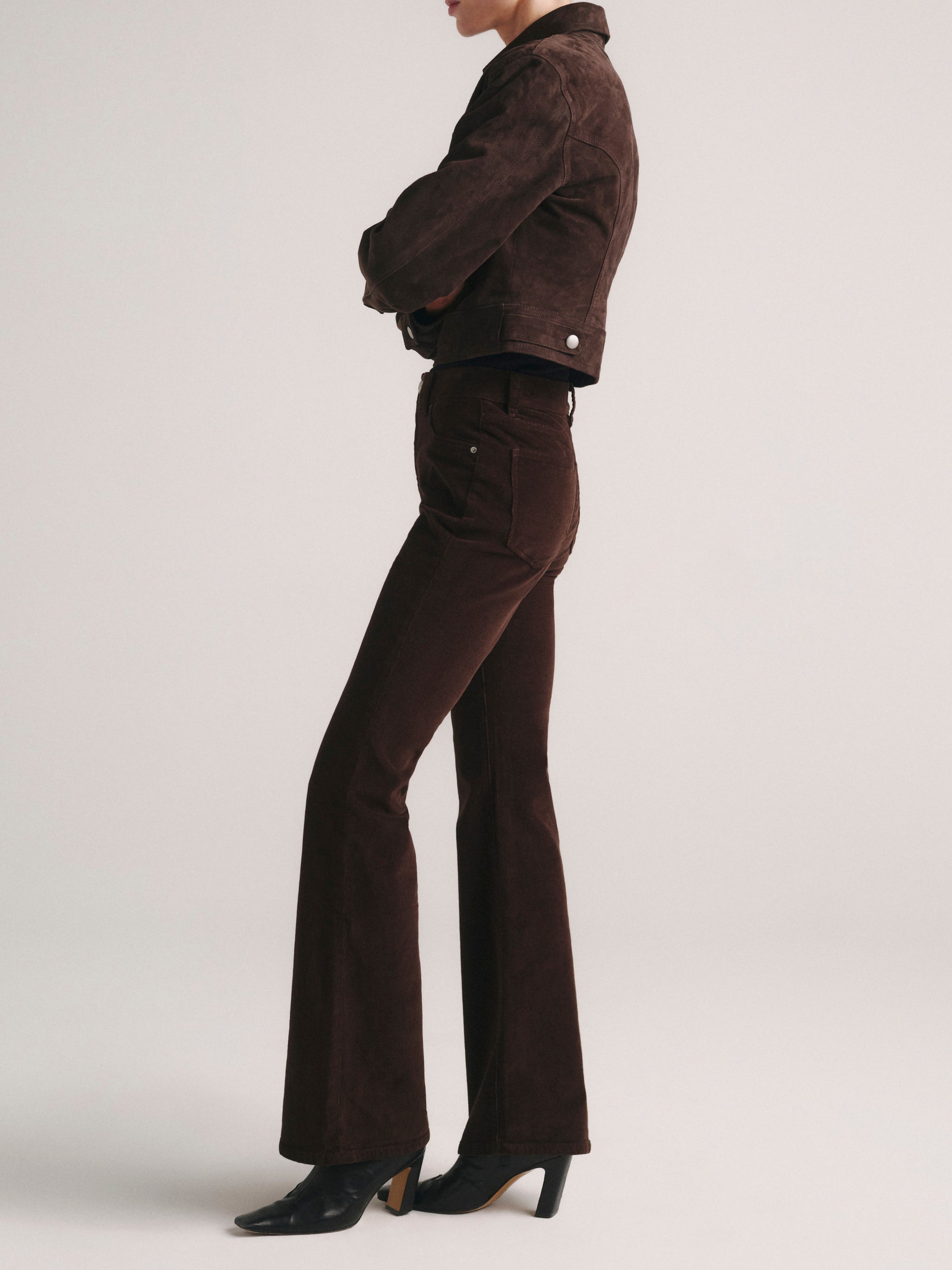 DL1961 Bridget Bootcut petite jeans in dark brown corduroy 'Meteorite', side profile view.