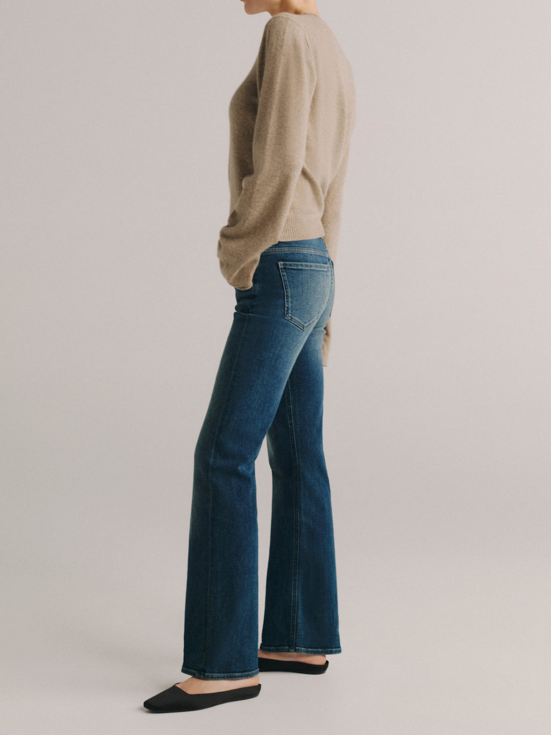 DL1961 Bella Slim Bootcut mid-rise jeans in faded medium-blue 'Deep Willow', side profile view.