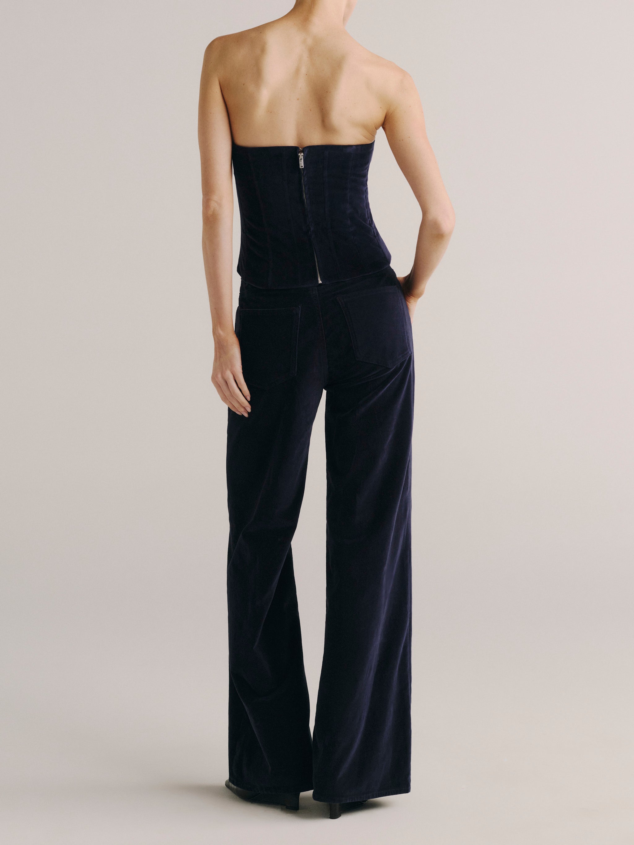 DL1961 women's Alex Baggy Wide Leg Low-Rise jeans in navy 'Ajax Velvet', back view showing the wide velvet leg.