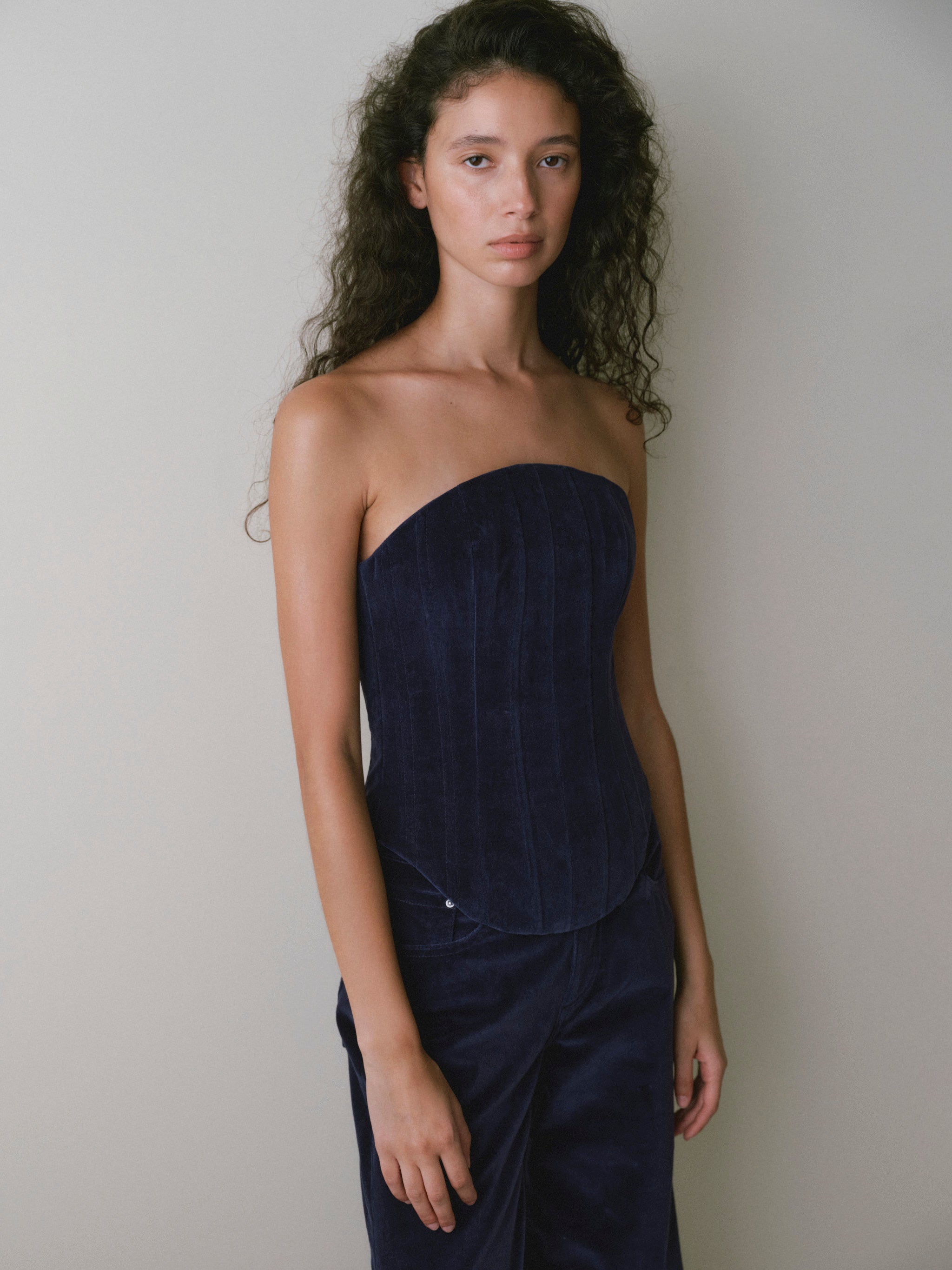 DL1961 women's strapless corset top in navy 'Ajax Velvet', close-up front view showing the boned velvet bodice.