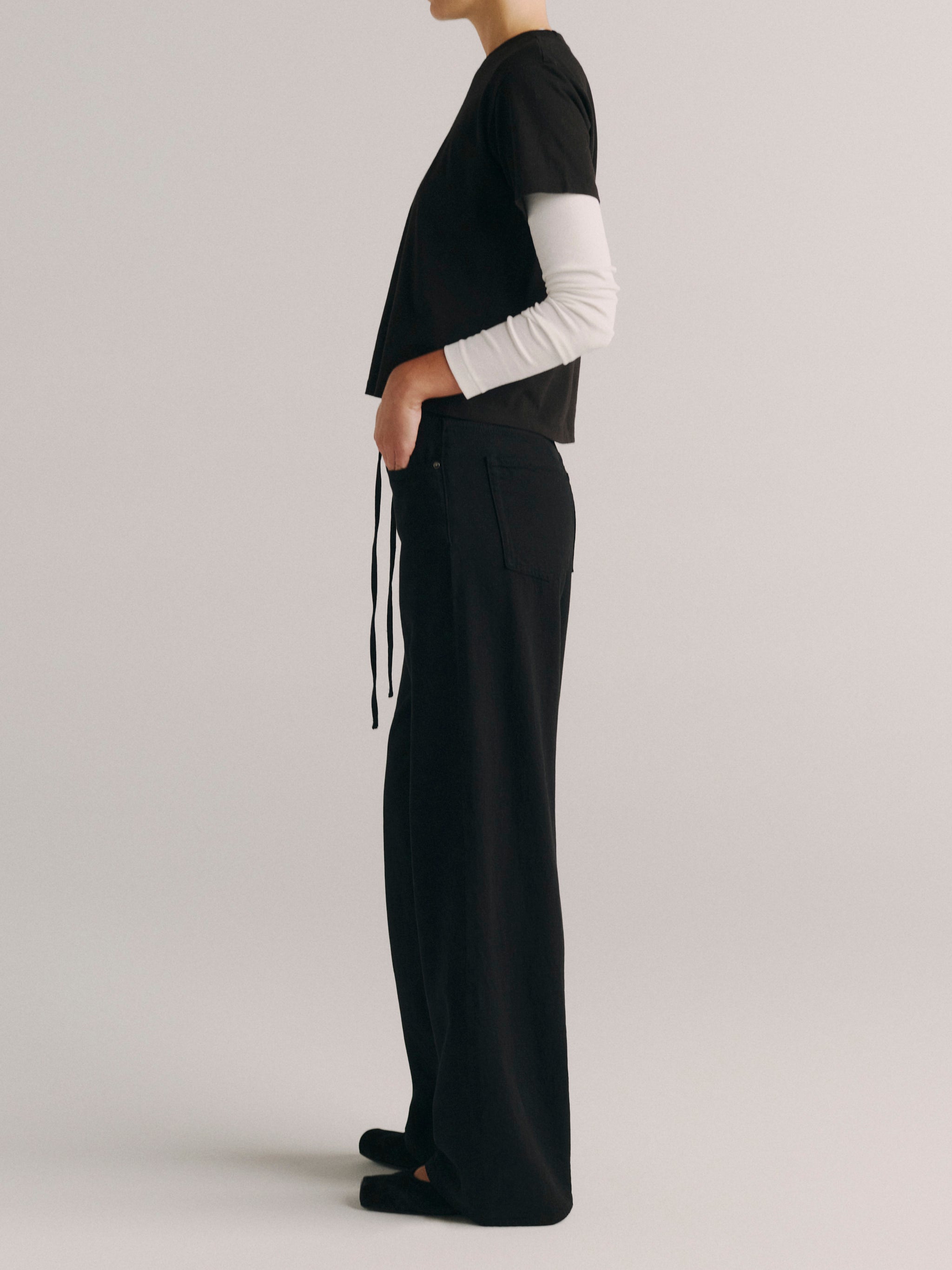 DL1961 women's Sienna Low-Slung Drawstring Wide Leg jeans in black 'Black Aura', side profile showing the relaxed wide leg.