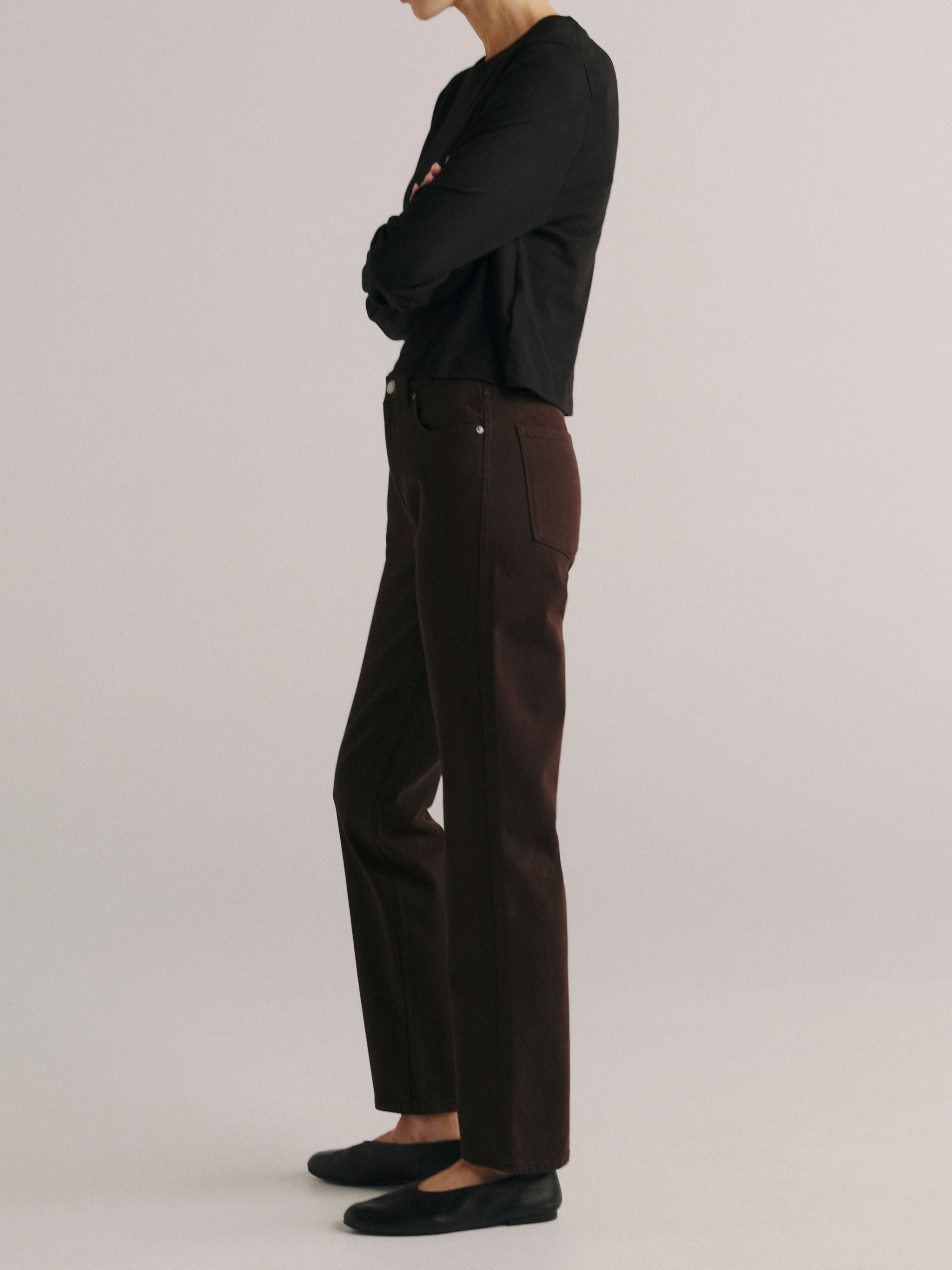 DL1961 women's Cate Stretch Straight High-Rise jeans in dark brown 'Tobacco', side profile showing the straight leg.