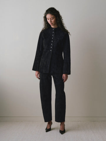 DL1961 women's Bilie Easy Barrel suede pants in black, full-length front view with a black suede jacket.