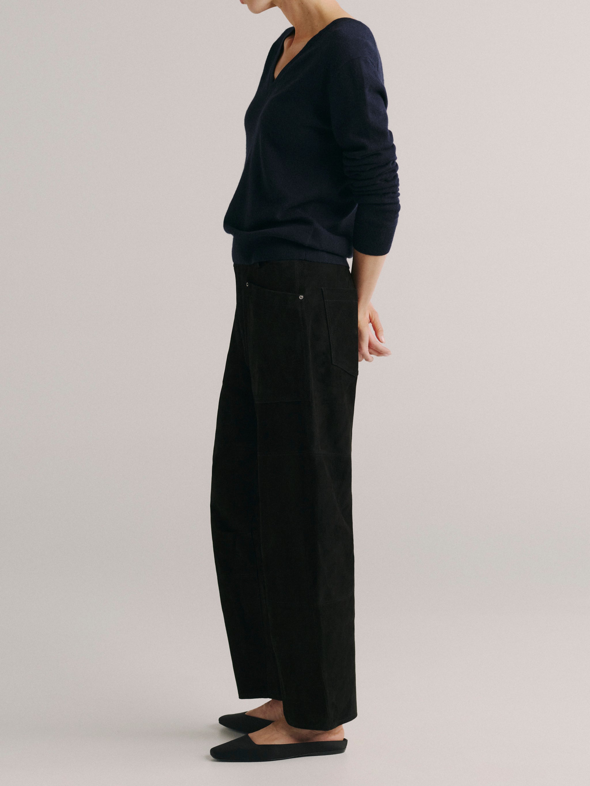 DL1961 women's Bilie Easy Barrel suede pants in black, side profile showing the barrel leg.