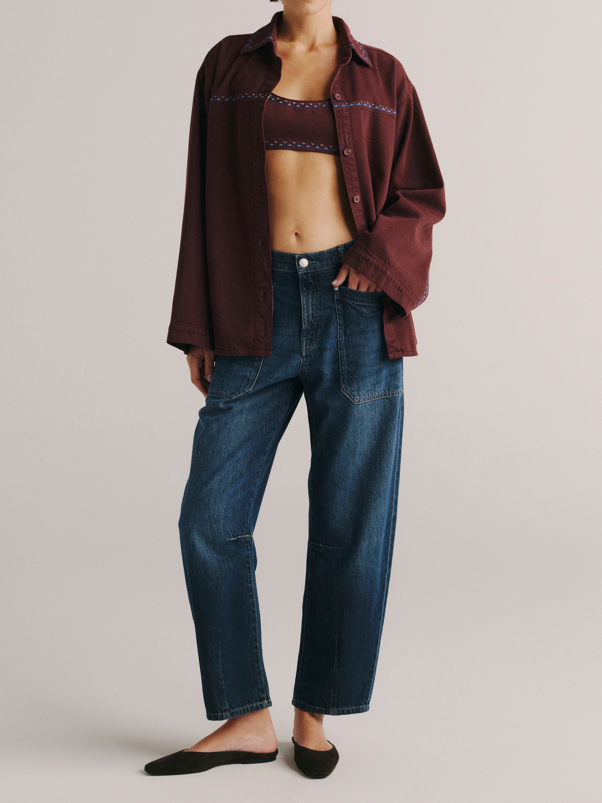 DL1961 women's Colette denim bralette in 'Burgundy Embroidery', front view layered under a matching burgundy overshirt.