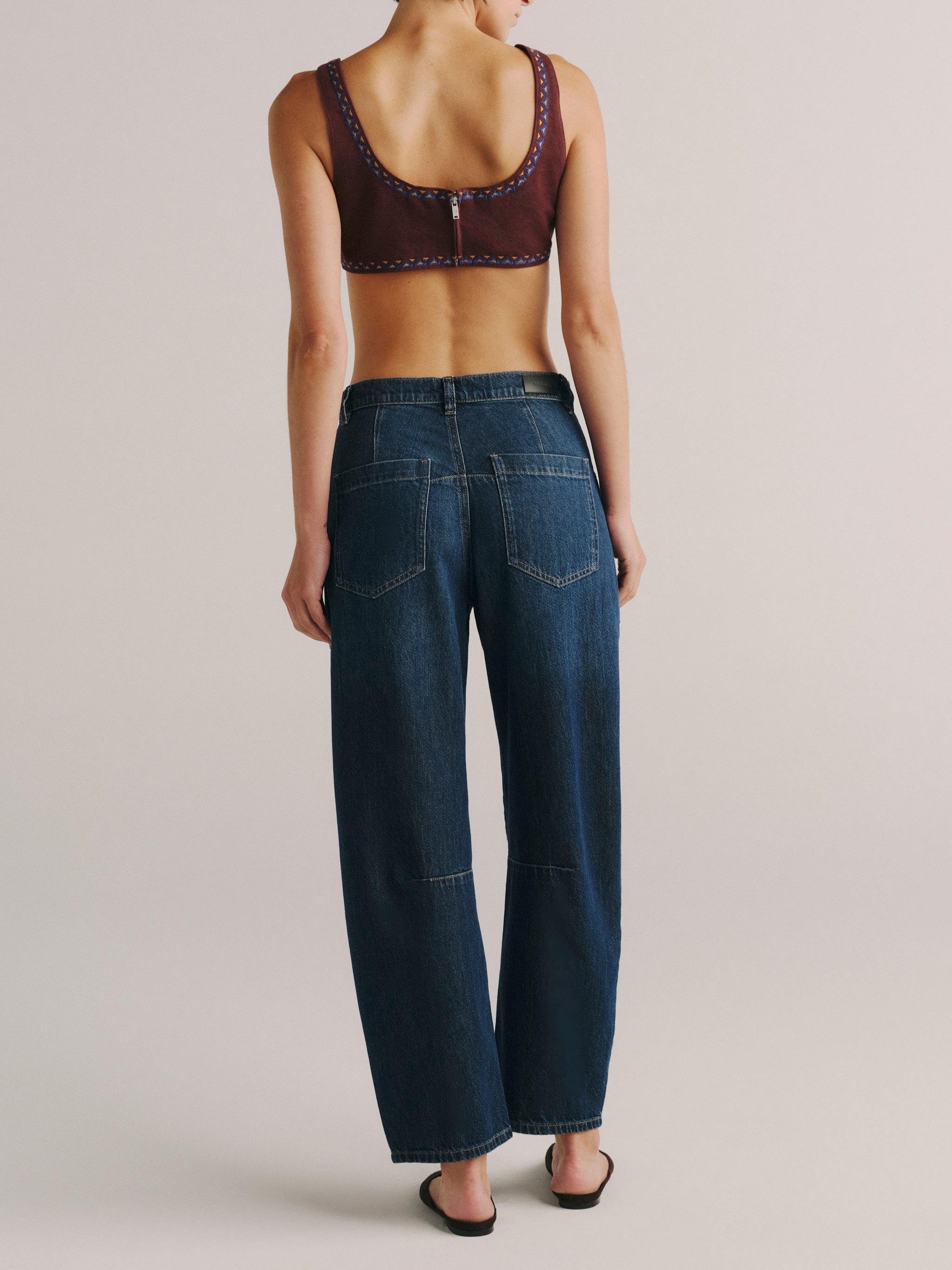 DL1961 women's Colette denim bralette in 'Burgundy Embroidery', back view showing the centre back zip.