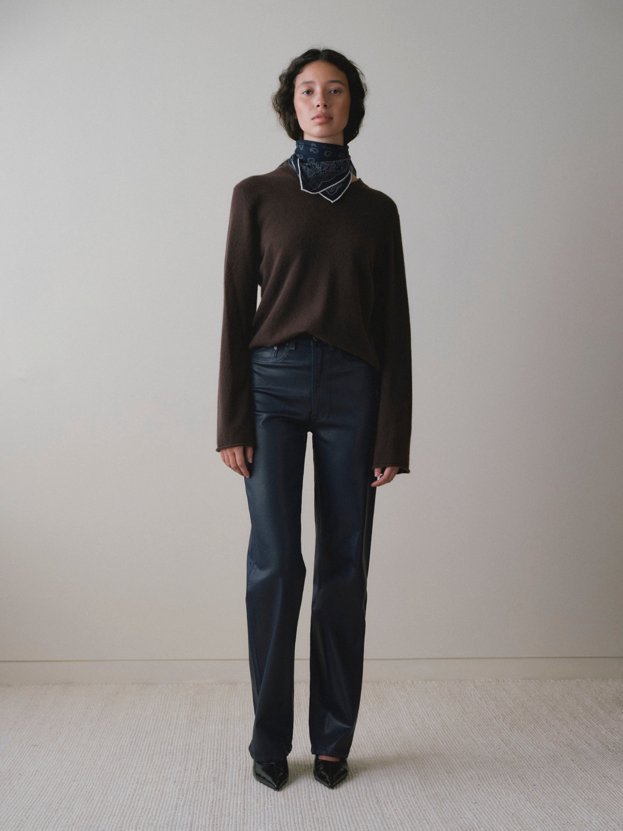 DL1961 women's Karmine Refined Wide Leg High-Rise jeans in coated navy 'Navy Blue Coated', front view showing the full wide leg.