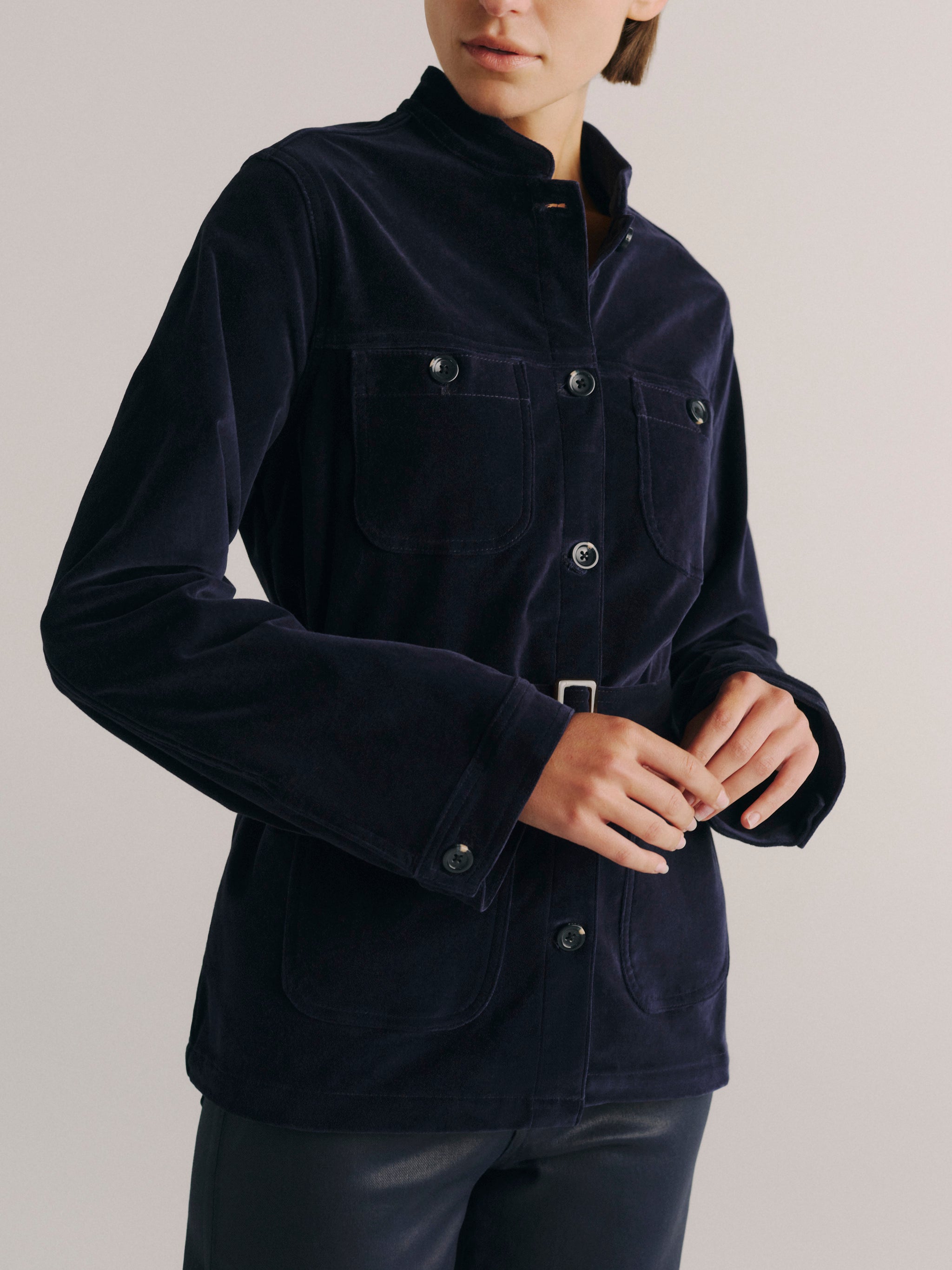 DL1961 women's Utility velvet jacket in navy 'Ajax Velvet', close-up front view of the buckle belt and chest pockets.