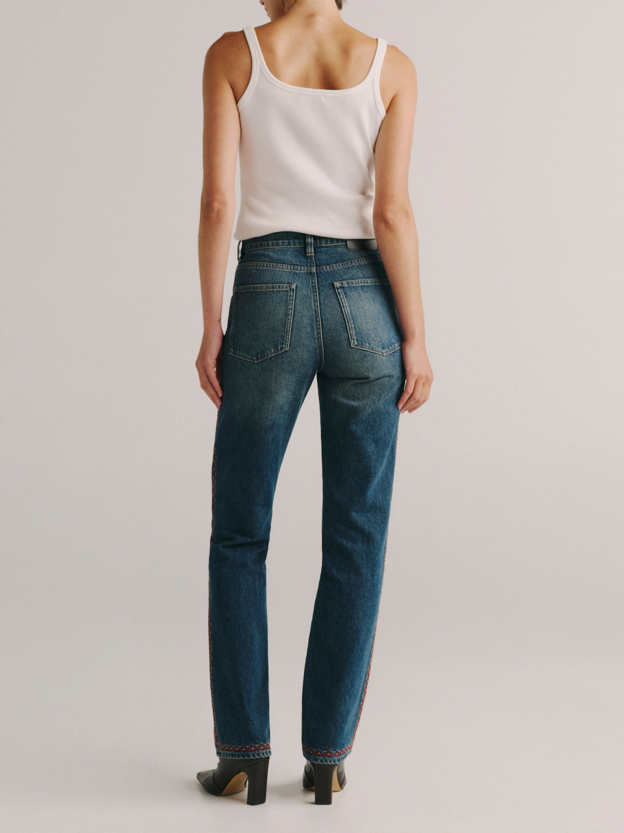DL1961 women's Cate Stretch Straight High-Rise jeans in medium blue 'Eternal Embroidery', back view showing the straight leg.