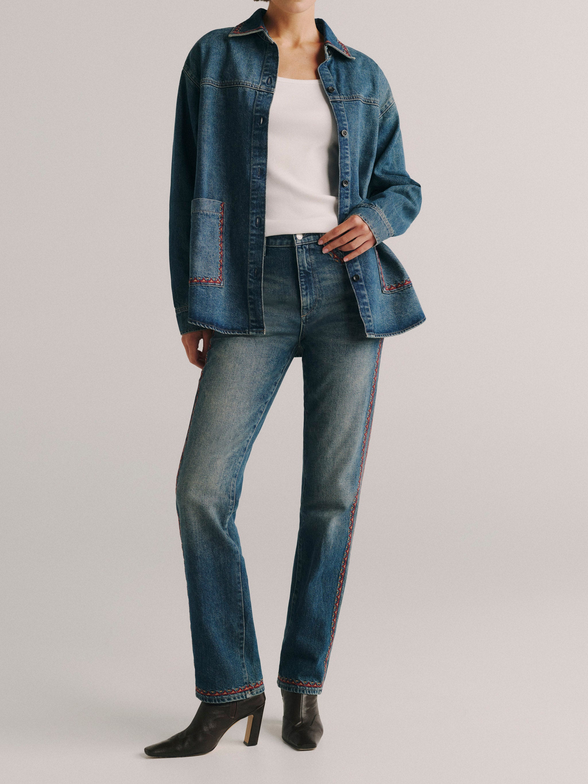 DL1961 women's Addison denim overshirt in 'Eternal Embroidery', full-length front view with matching embroidered jeans.