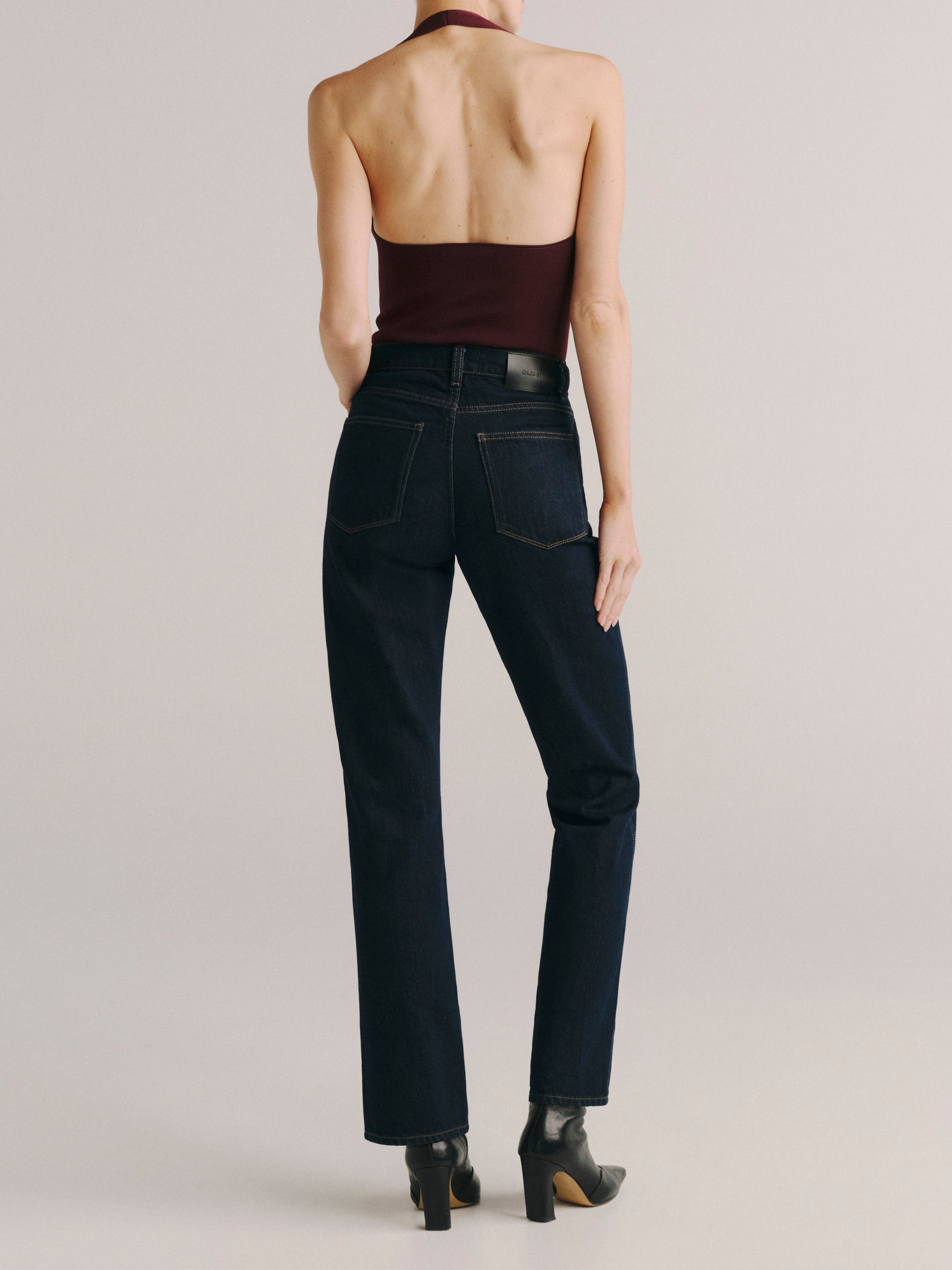 DL1961 women's Cate Classic Straight High-Rise jeans in dark indigo 'Harvest Moon', back view showing the rear pockets.