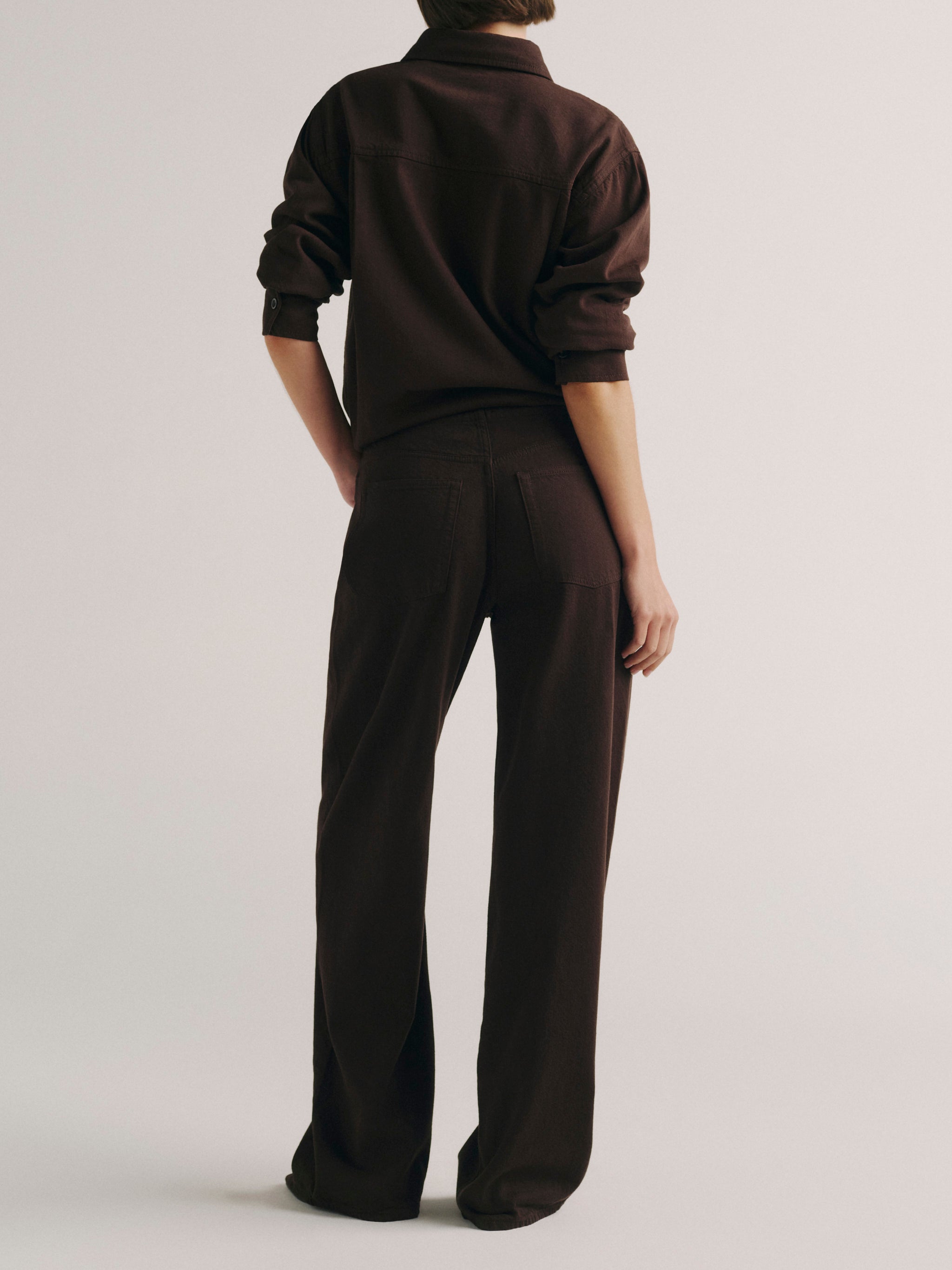 DL1961 women's Faye oversized denim shirt in dark brown 'Tobacco Aura', back view showing the oversized fit.