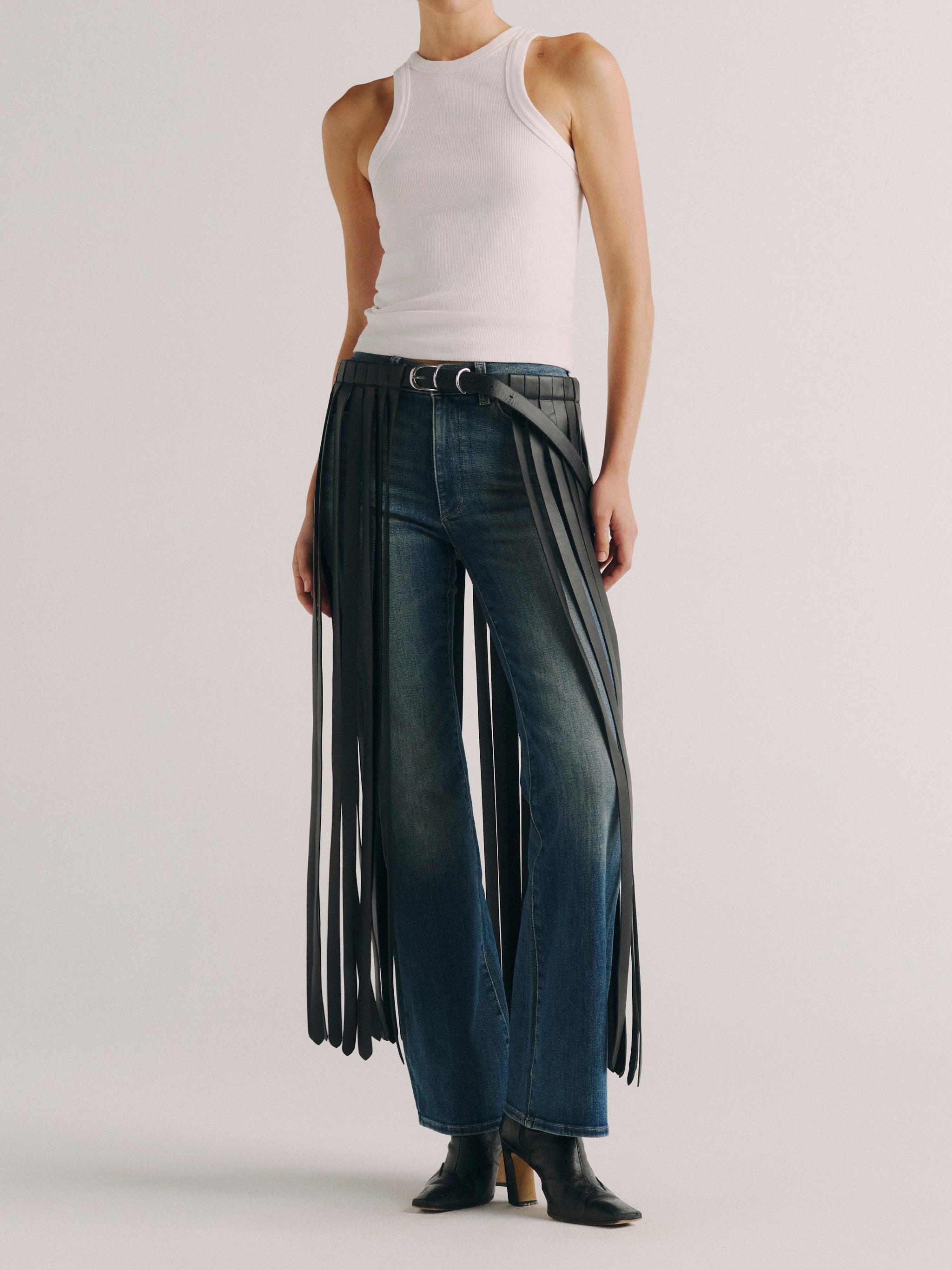 DL1961 fringe leather belt in black, full-length front view showing the fringe falling to the hem.