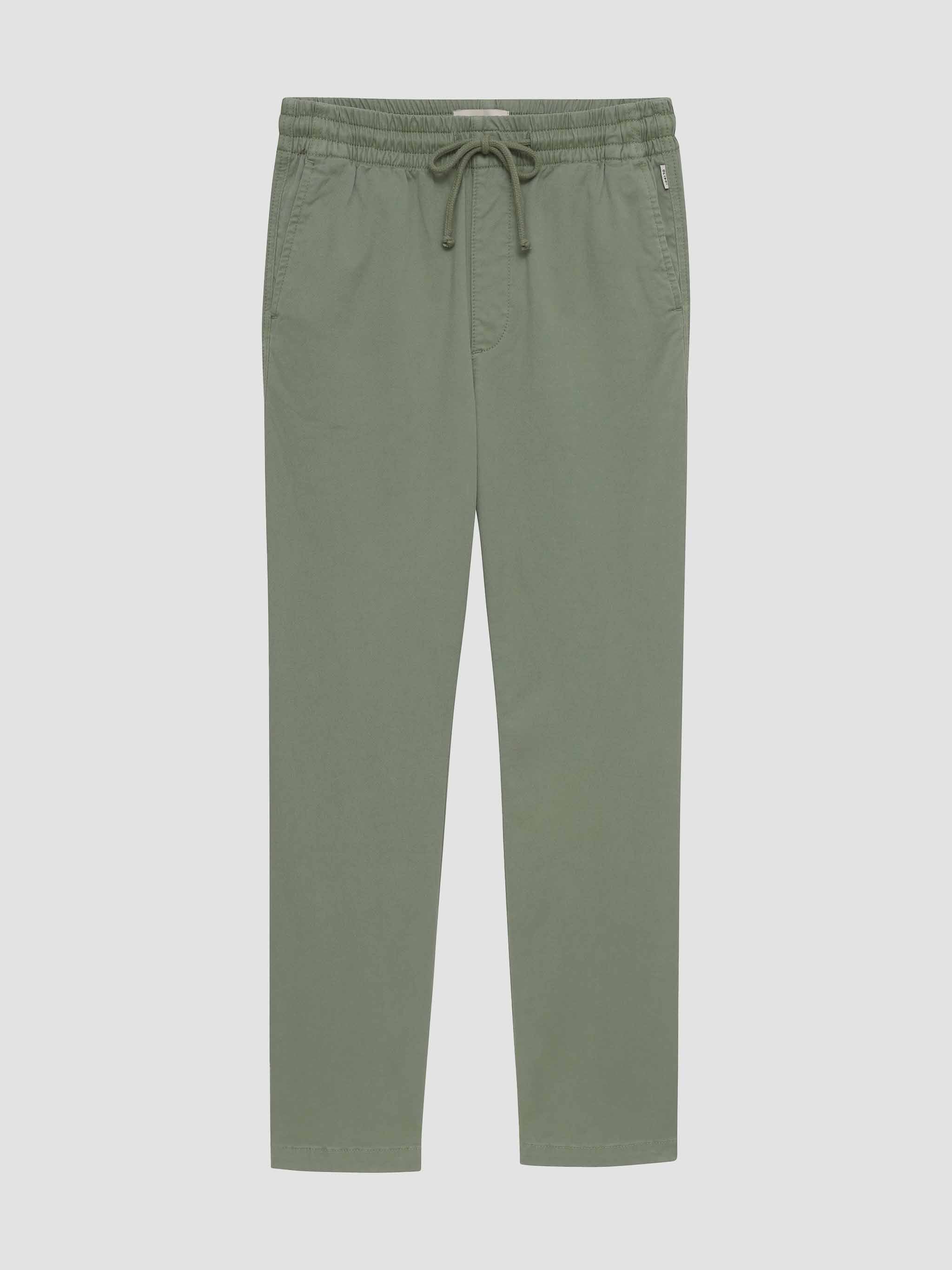 Green pants with a drawstring on a light gray background