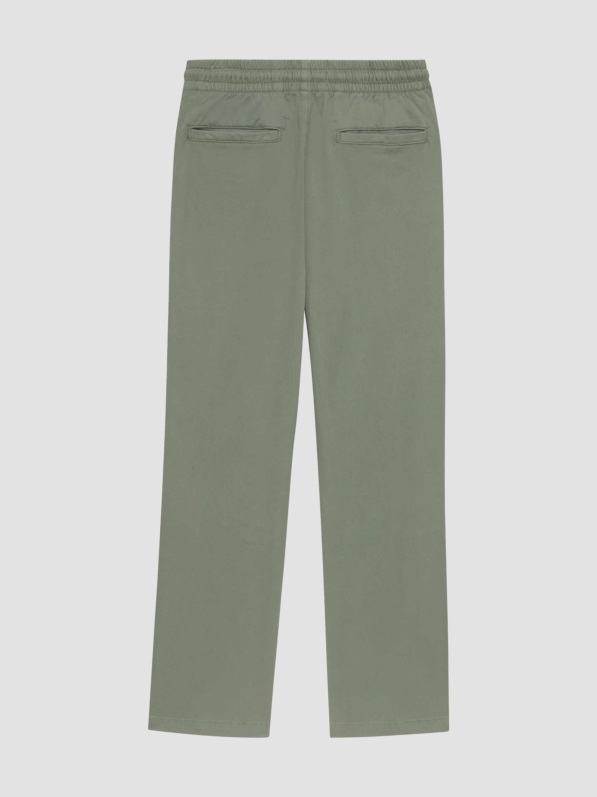 Green pants on a light gray background