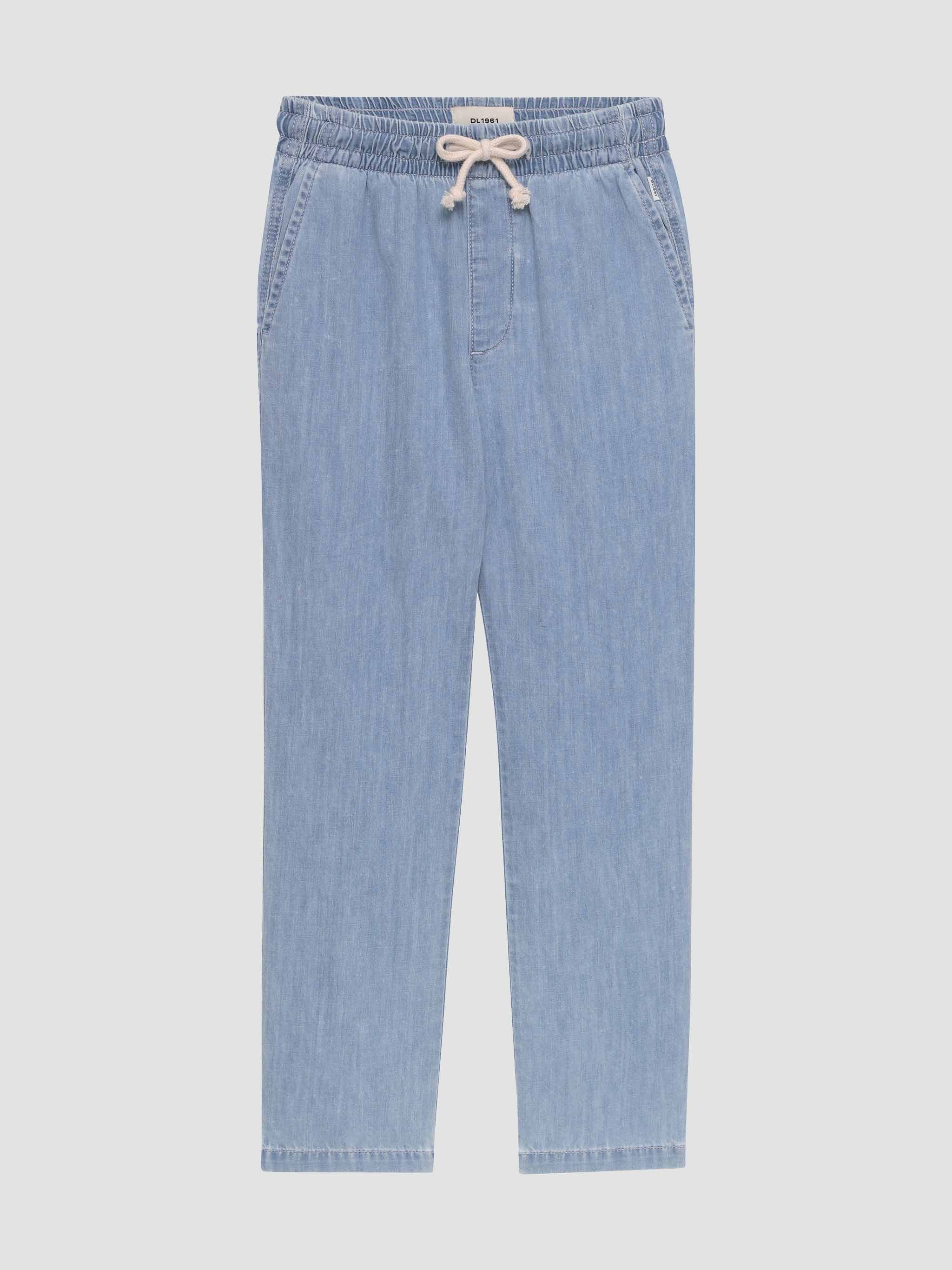 Light blue denim pants with a drawstring on a light gray background