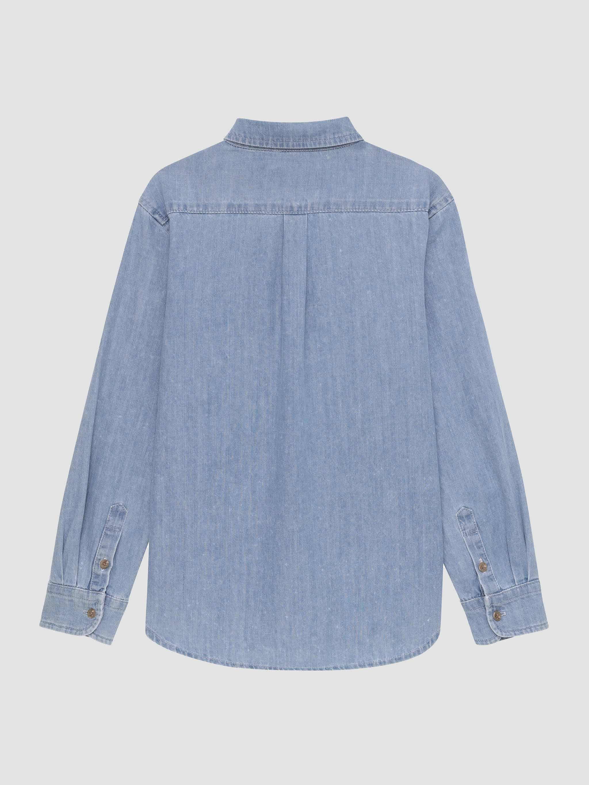Light blue denim shirt on a white background