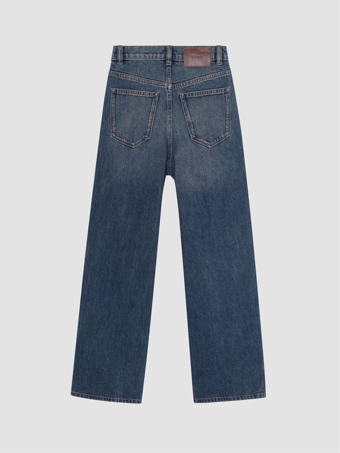 DL1961 boys' Mason Baggy wide-leg jeans in blue 'Tinted Dark', leather waist patch, flat back view.