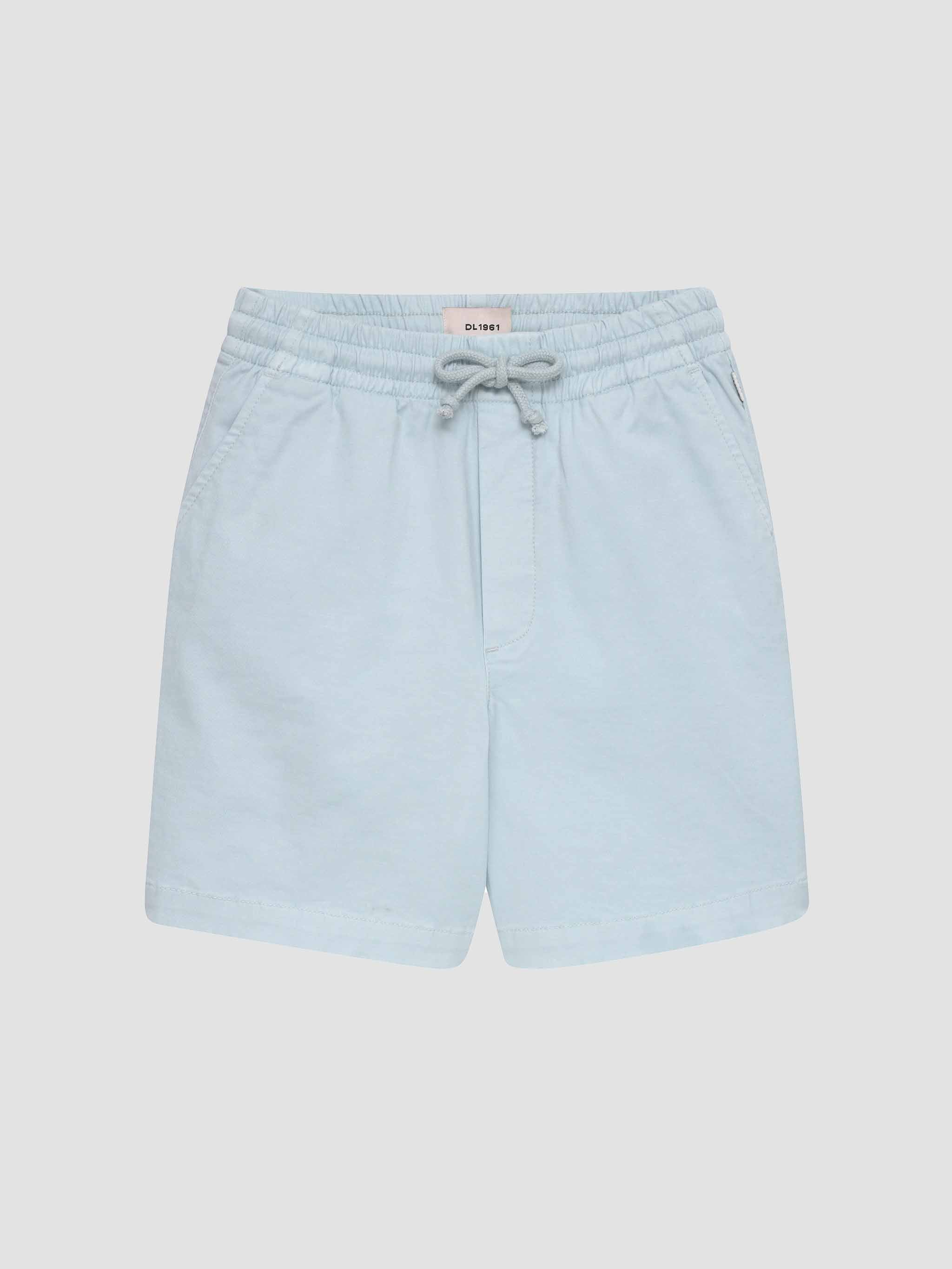 Light blue shorts on a light gray background