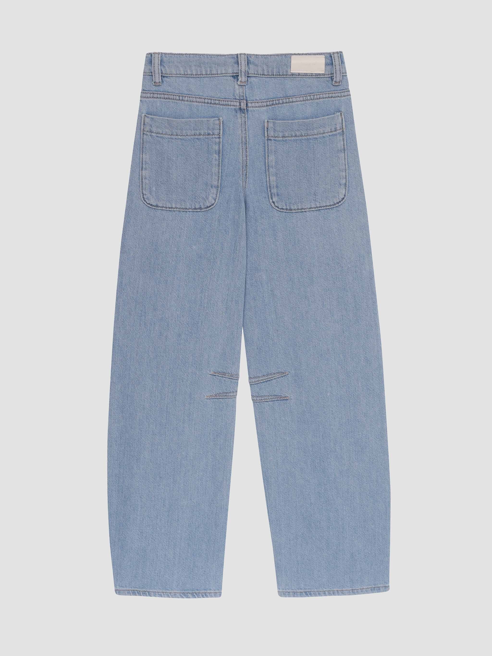 Light blue jeans with a slight distressed look on a white background