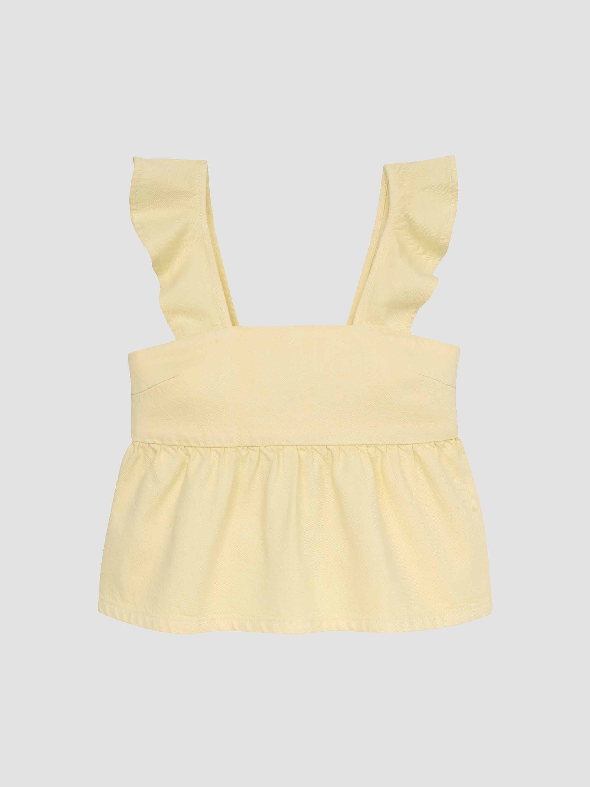 Yellow sleeveless top on a light gray background